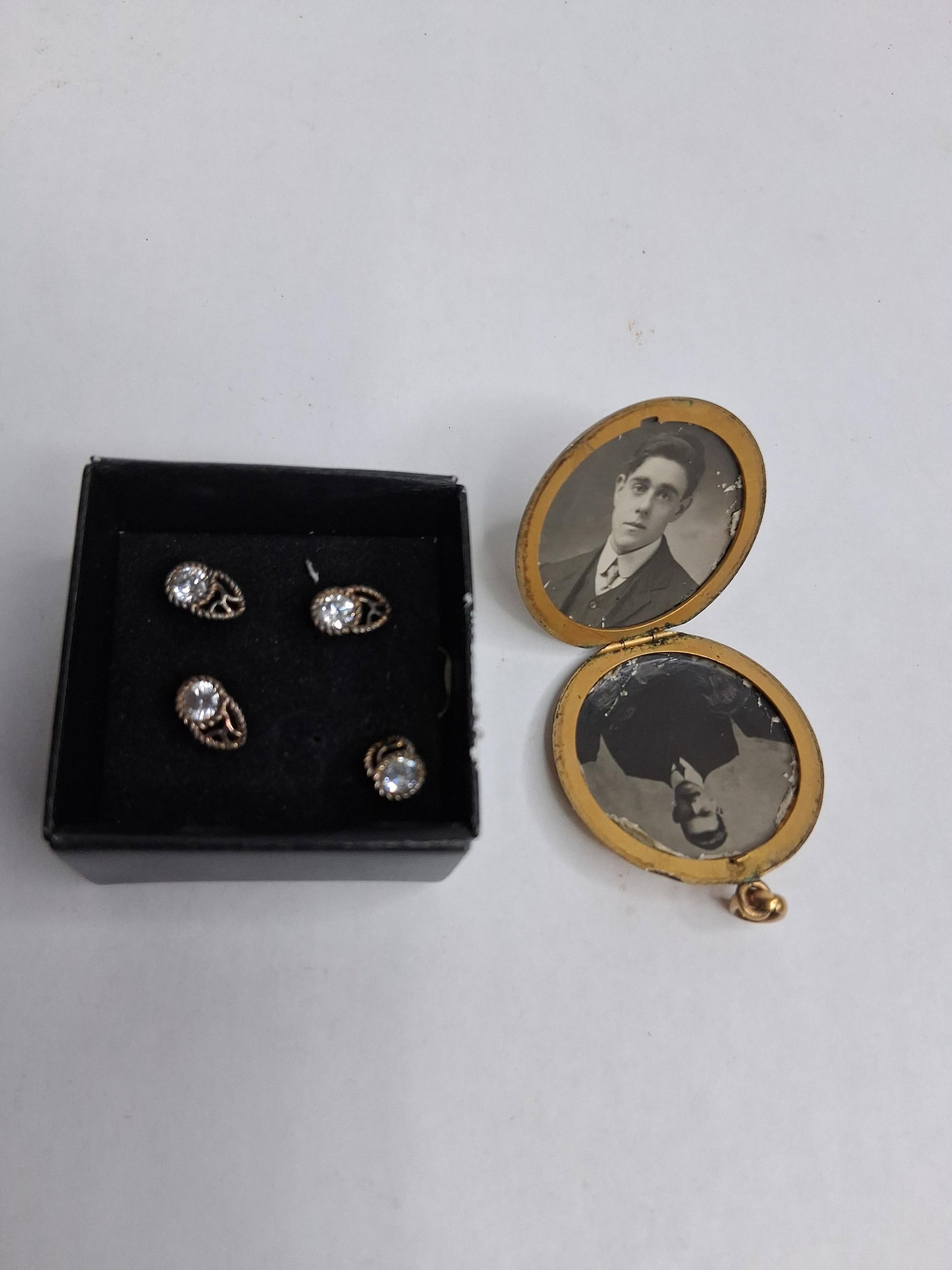 Gold-Filled Engraved Locket & 4 Studs: This group comprises an oval-shaped gold-filled locket pendant and a set of four matching shirt studs. The locket features a front face engraved with a stylized script monogram centering on the letter