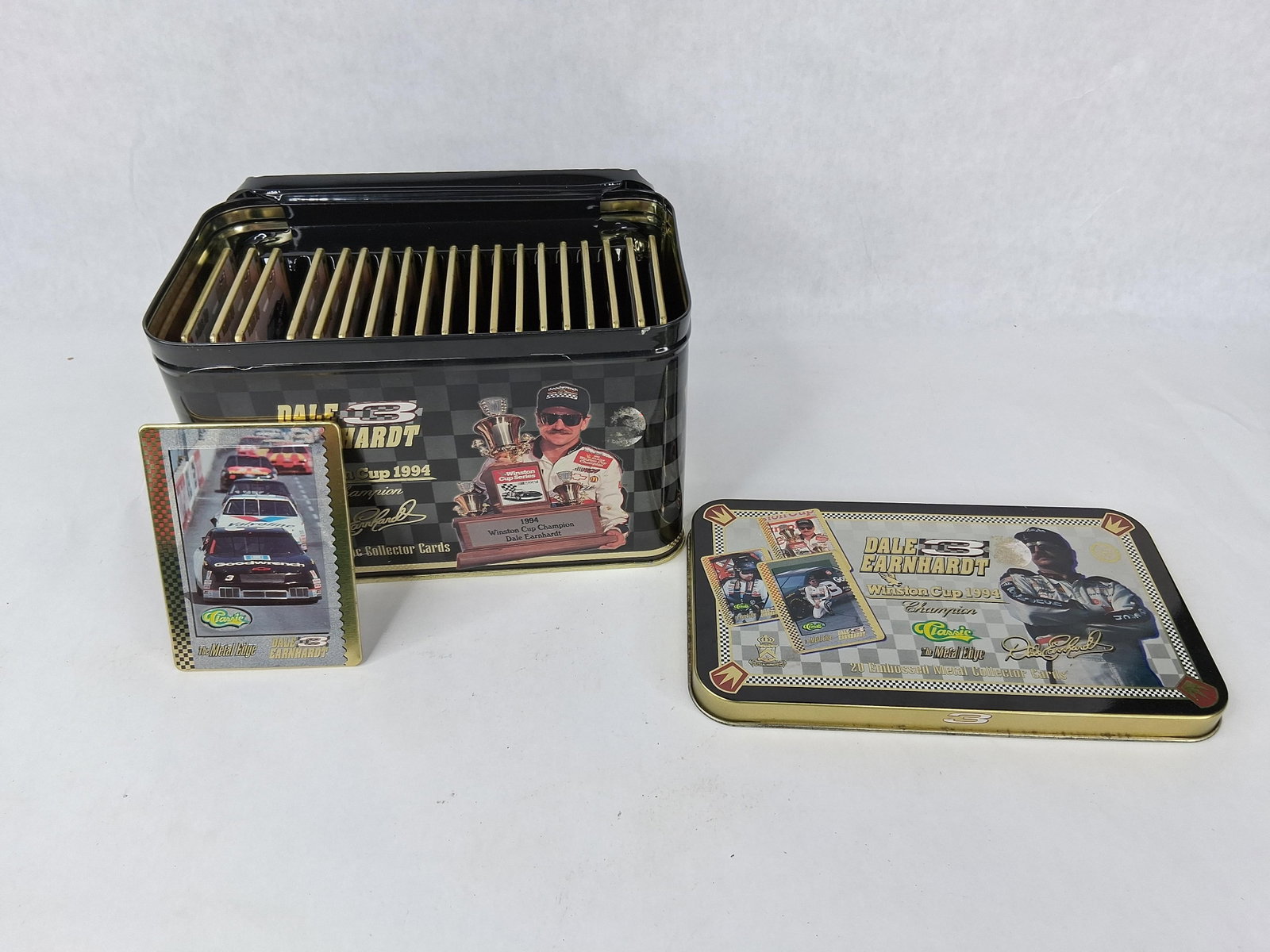 1994 Dale Earnhardt Metal Edge Card Set: A complete set of 20 embossed metal collector cards featuring Dale Earnhardt, produced by Classic in association with Metallic Impressions to commemorate his 1994 NASCAR Winston Cup Championship. The