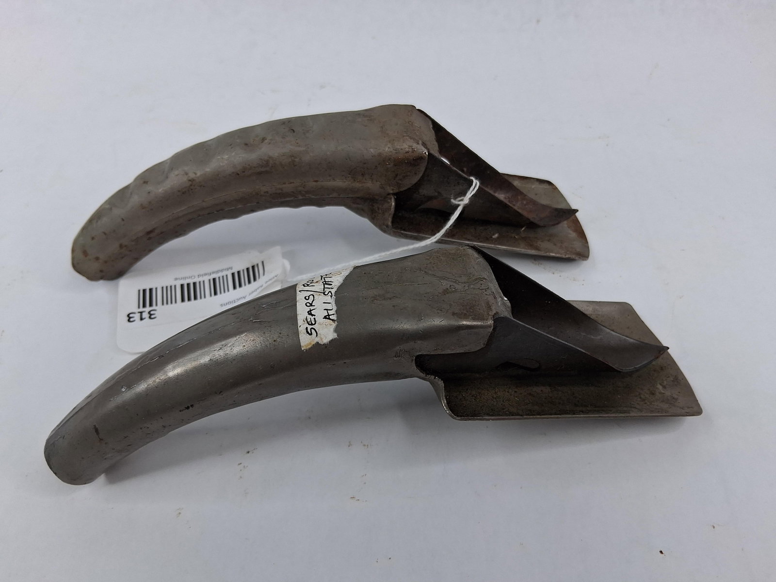 Brookins & Allstate Oil Spouts/Openers: This lot features two automotive tools designed for opening and pouring from metal oil cans. The first item is an Allstate brand tool manufactured for Sears, Roebuck and Co., stamped as Model No. 4748