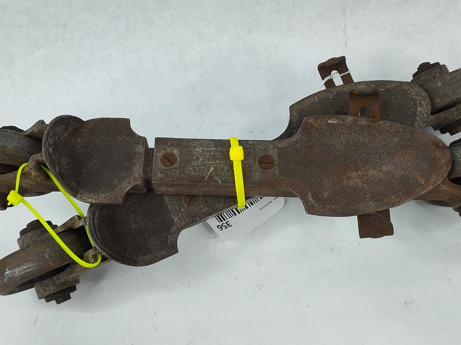 Pair Streamline Wheeler In-Line Skates: A pair of heavy-duty metal in-line roller skates manufactured by Streamline Wheeler. These skates feature a two-wheel in-line design with a heavy-gauge steel and cast iron construction. The frames