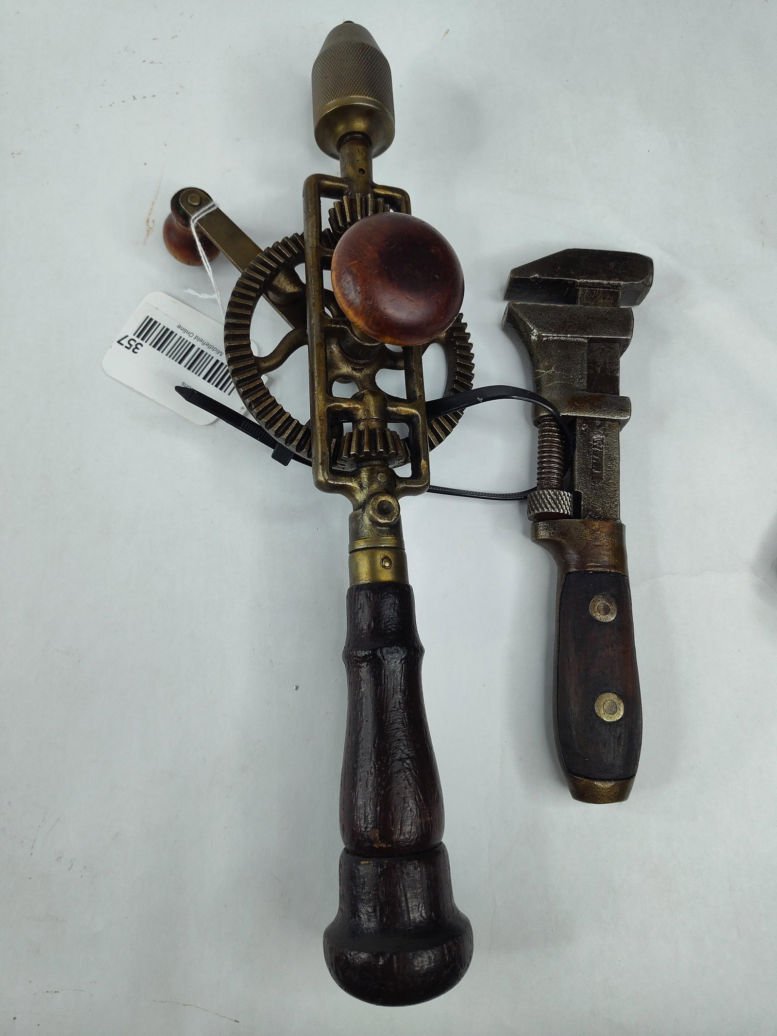 Bemis & Call Wrench & Brass Hand Drill: This lot consists of two antique American hand tools from the late 19th or early 20th century. The first is an adjustable monkey wrench manufactured by the Bemis and Call Hardware and Tool Company.