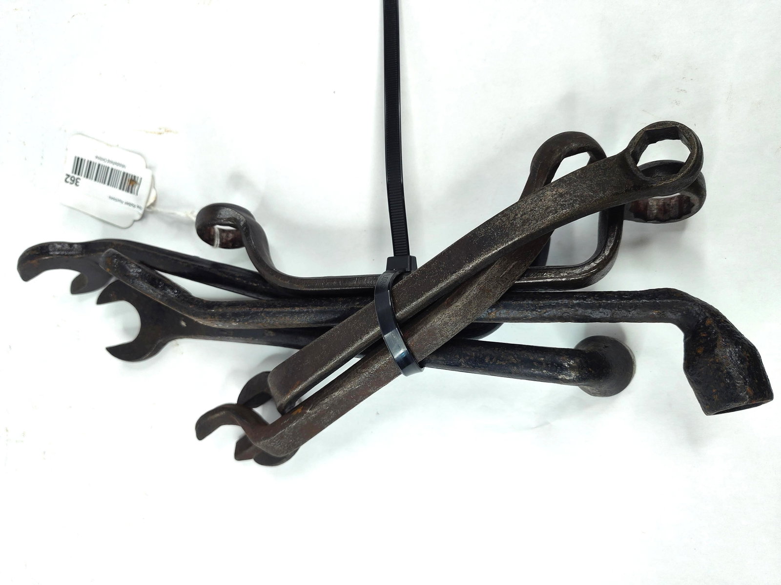 Ford & Fordson Auto & Tractor Wrenches: This collection includes multiple antique forged steel hand tools identified as early Ford Motor Company and Fordson tractor maintenance tools. The assortment features various specialized head designs