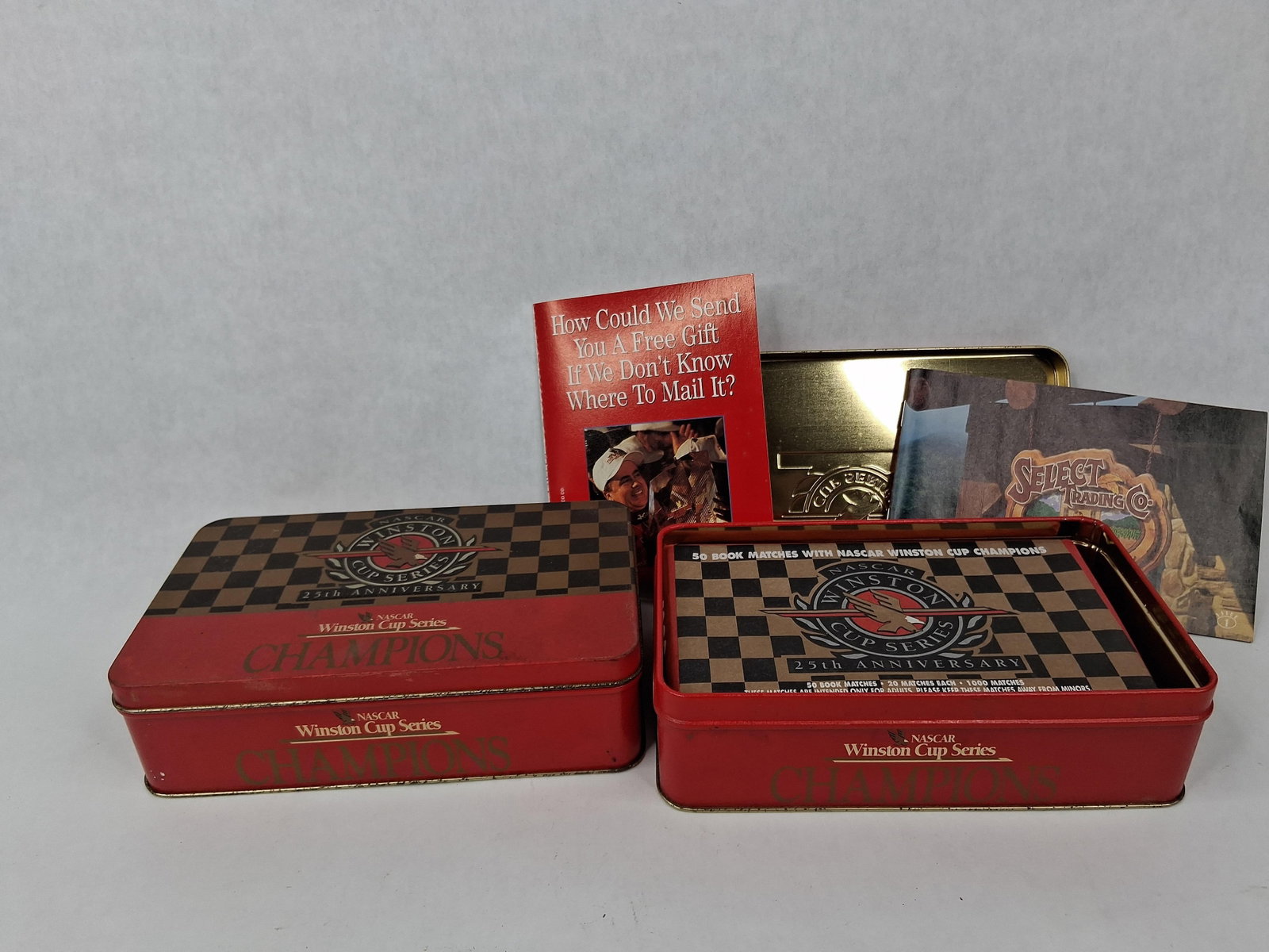 Pair NASCAR Winston Cup 25th Anniv Tins: This lot consists of two matching NASCAR Winston Cup Series 25th Anniversary promotional sets produced by R.J. Reynolds Tobacco Co. circa 1995. The collection includes two lithographed metal