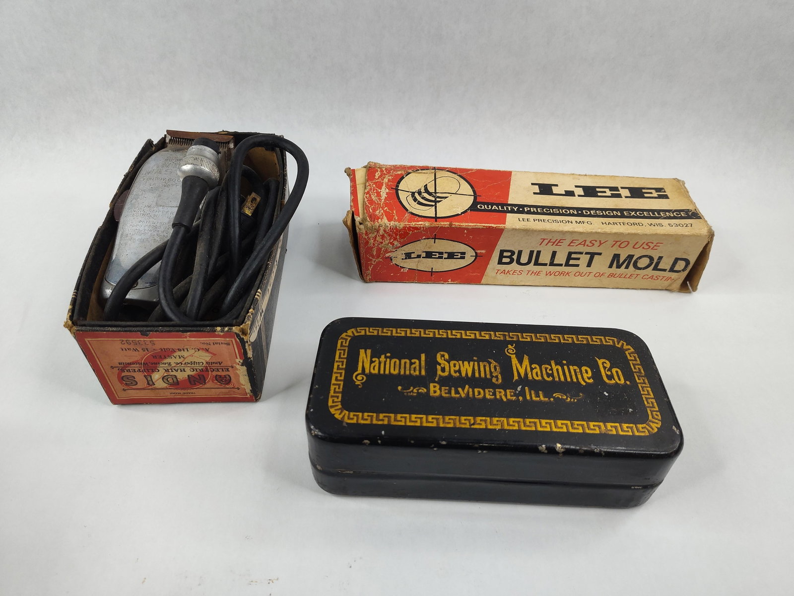 Andis Clippers, Lee Mold & Nat. Sewing: Three American mechanical items produced by Andis, Lee Precision, and the National Sewing Machine Company. The lot includes a set of Andis Master electric hair clippers, Model M, featuring a