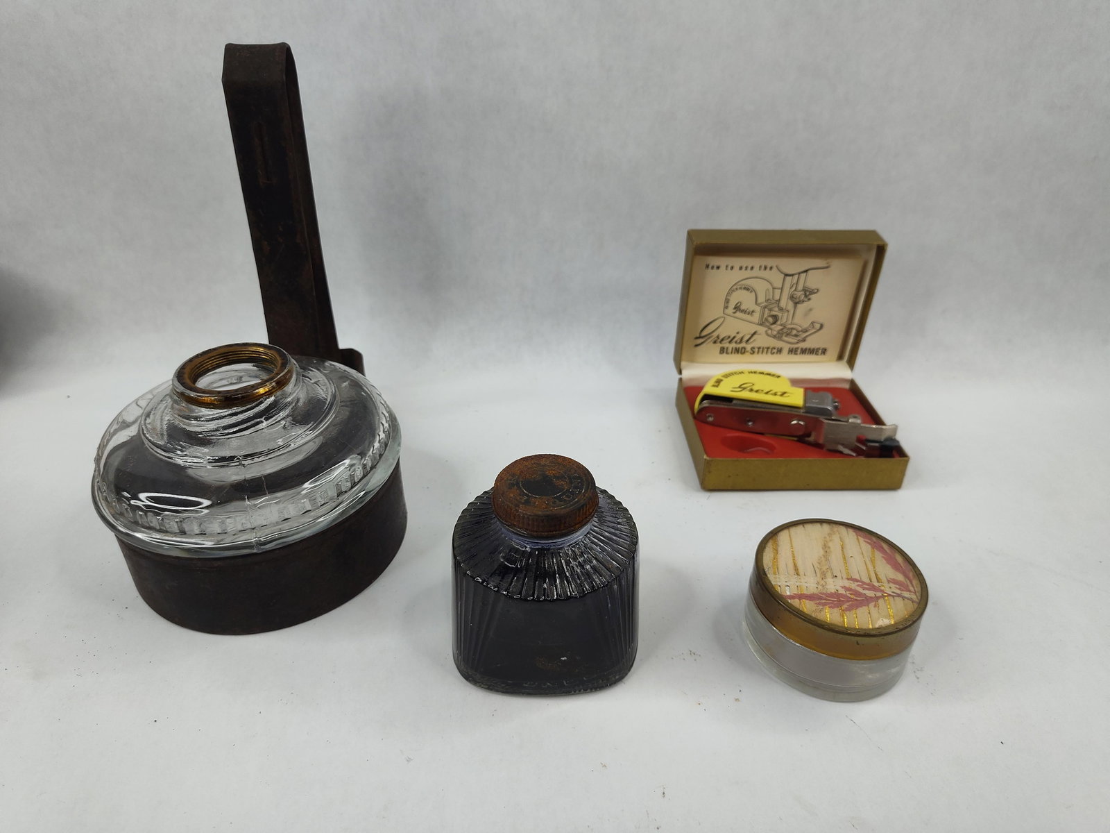Parker Quink Inkwell & Greist Hemmer: An assortment of household and desk accessories. The collection includes a Parker Quink ink bottle with a clear glass body featuring fluted vertical ribbing and a metal screw-on cap embossed with the