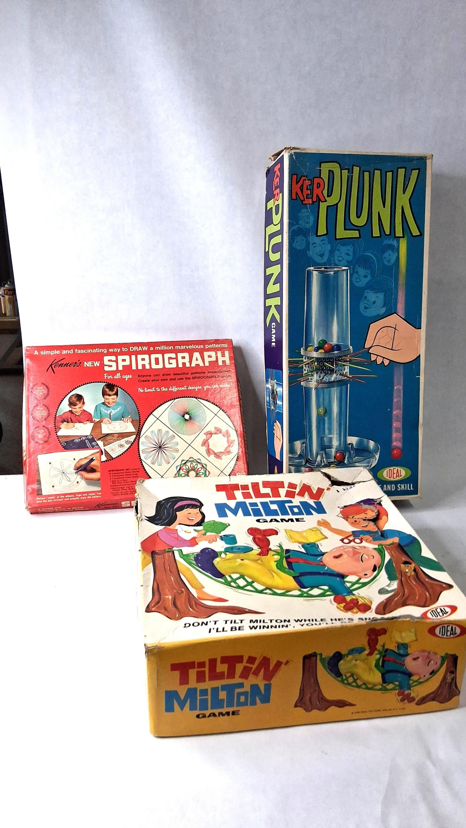 3 Kenner & Ideal Games & Sets 1967-1968: This lot features three games and creative sets produced by Kenner Products Co. and Ideal Toy Corp. between 1967 and 1968. The first set is a Kenner's Spirograph from 1967, featuring its original red 