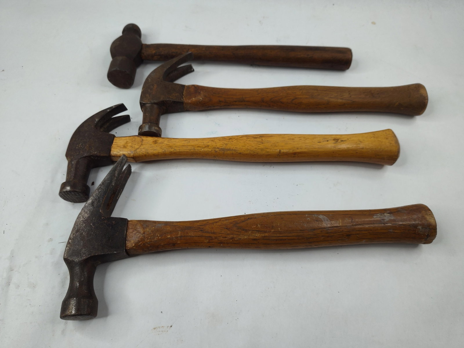 4 Vtg Simmons & Plumb Steel Hammers: This group consists of four hammers featuring forged steel heads and hardwood handles, including one ball-peen hammer and three claw hammers. A notable piece in the collection is a claw hammer