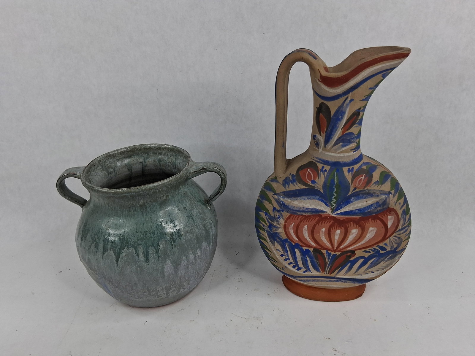 Brown's Pottery Jar & Tonala Pitcher: This lot consists of two pieces of earthenware art pottery. The first item is a bulbous two-handled jar from Brown's Pottery in Eureka, Montana. The vessel features a flared rim and opposing loop hand