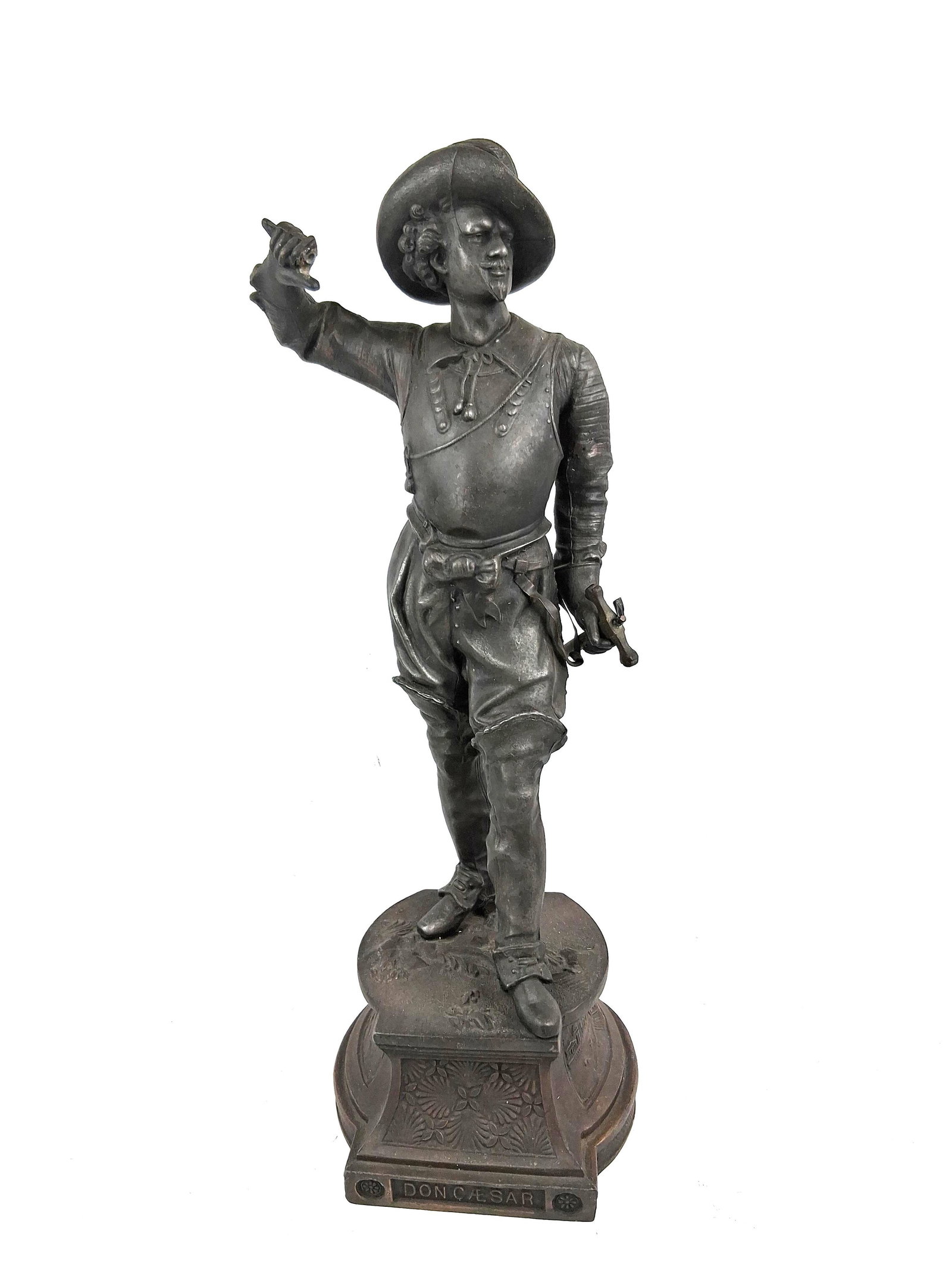 Poitevin Don Caesar de Bazan Sculpture: Cast spelter sculpture with a dark bronze-toned patina after Philippe Poitevin, depicting the character Don Caesar de Bazan. The standing figure is depicted in a theatrical pose, wearing