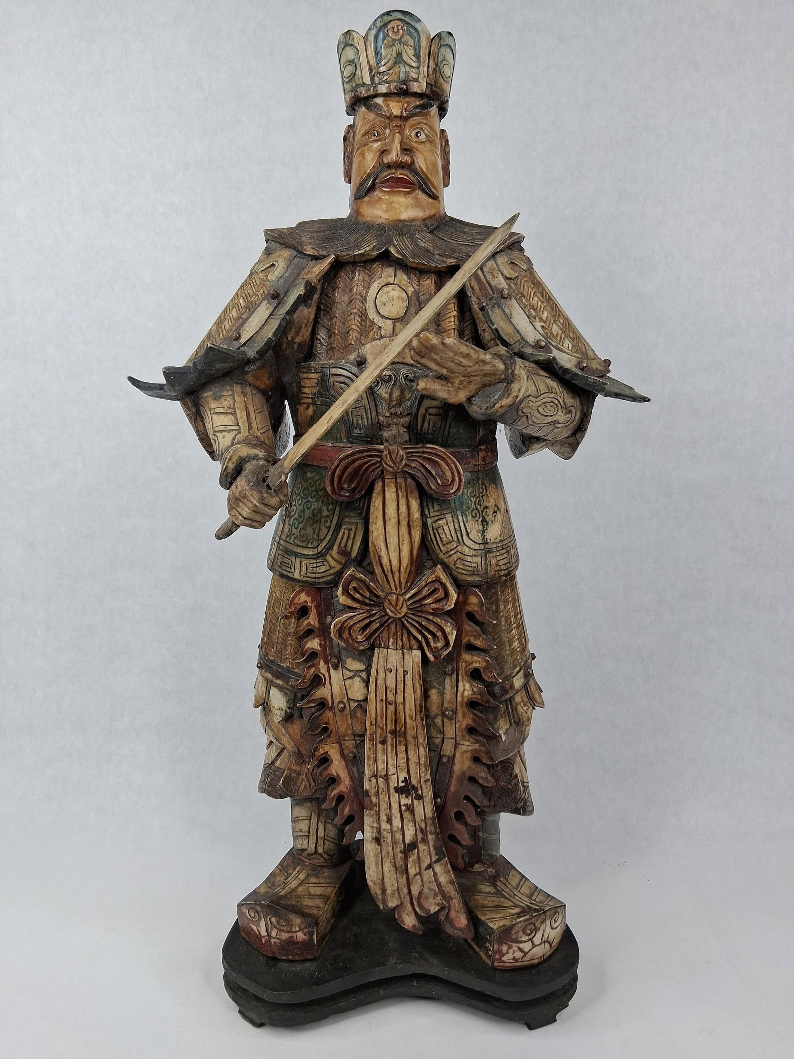 Chinese Polychrome Bone Guardian King: A large Chinese figure of a guardian deity, possibly a Guardian King or Tianwang, constructed from multiple pieces of carved ox bone joined and pinned together. The warrior is depicted in elaborate