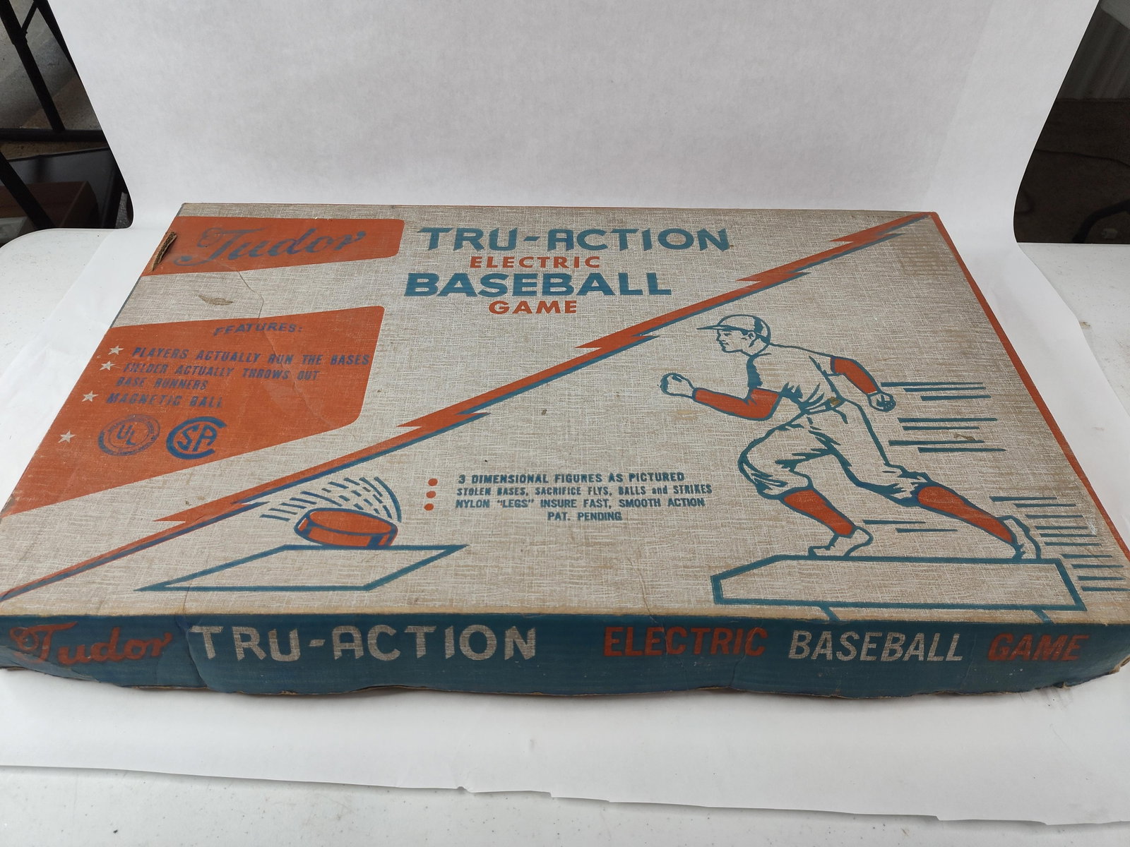 Tudor Tru-Action Electric Baseball Game: This tabletop electric sports game is a Tudor Tru-Action Electric Baseball Game, Model No. 550, manufactured by Tudor Metal Products Corp. of Brooklyn, New York. The set features a lithographed green