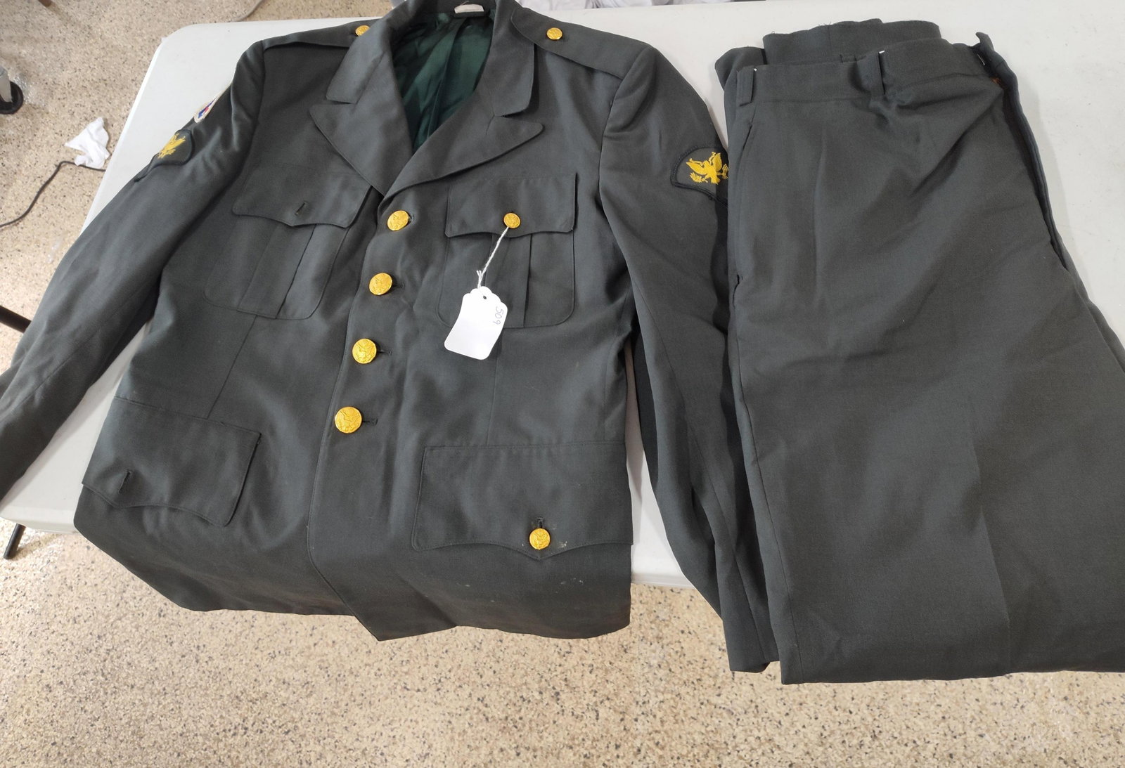 1980 US Army 173rd Airborne Uniform: This is a two-piece United States Army Green Service Uniform, commonly referred to as Class A Greens. The set consists of a four-button tunic and matching trousers in the standard AG 344 Army Green