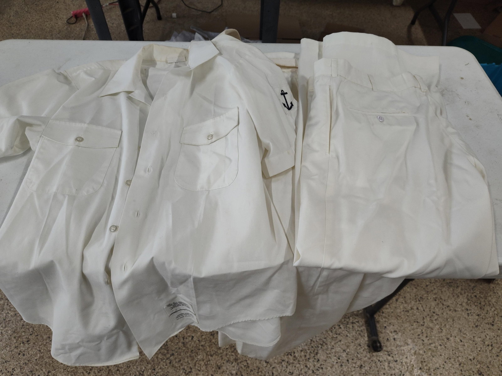 1990s US Navy White Uniform: Mayor W.R: This group of United States Navy Summer White uniform items is named to an individual identified as MAYOR, W. R. with service number 4019. The set includes two short-sleeved shirts, one pair of