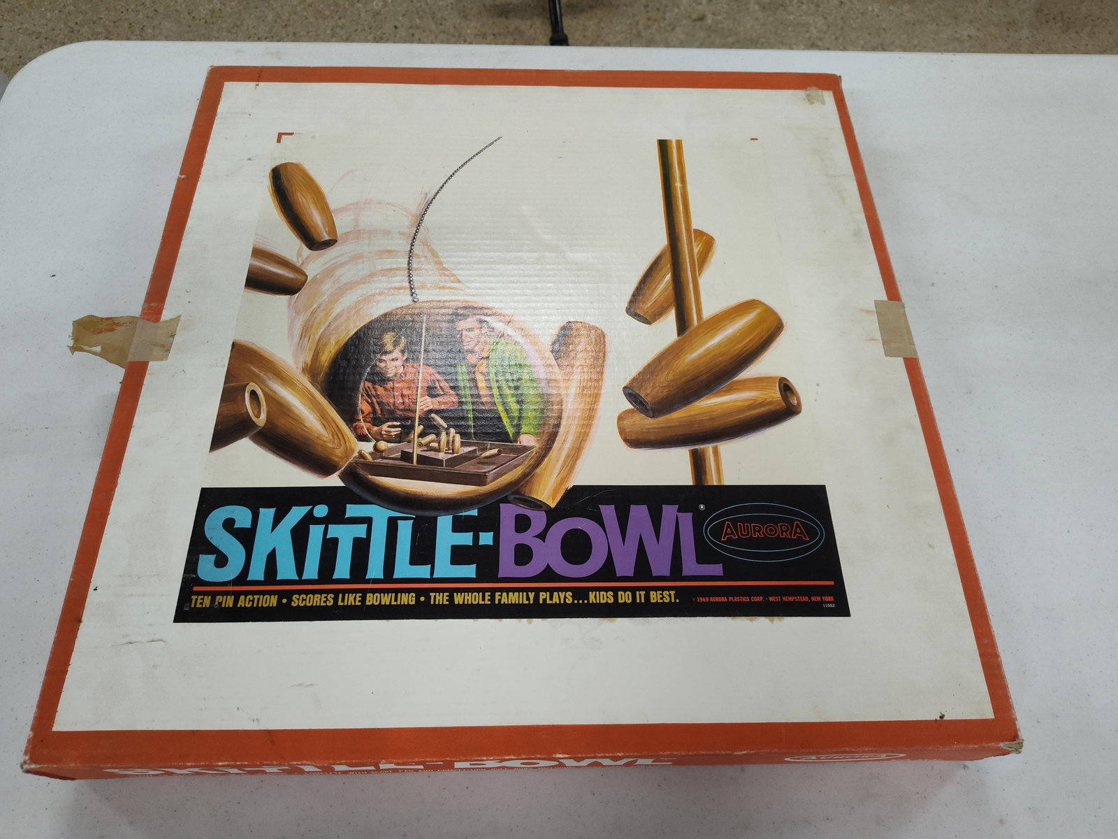 Aurora Skittle-Bowl Vtg Game Model 550: This is an Aurora Plastics Corp. Skittle-Bowl tabletop action game, manufactured in West Hempstead, New York, with a copyright date of 1969. The game functions via a gravity-fed swing-ball mechanism,