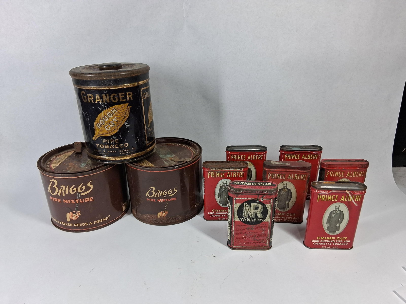 10 Vtg Litho Metal Tobacco & Med Tins: This is a collection of 10 vintage lithographed metal advertising tins consisting of humidor-style canisters and pocket-sized containers. The group features various early to mid-20th-century American 