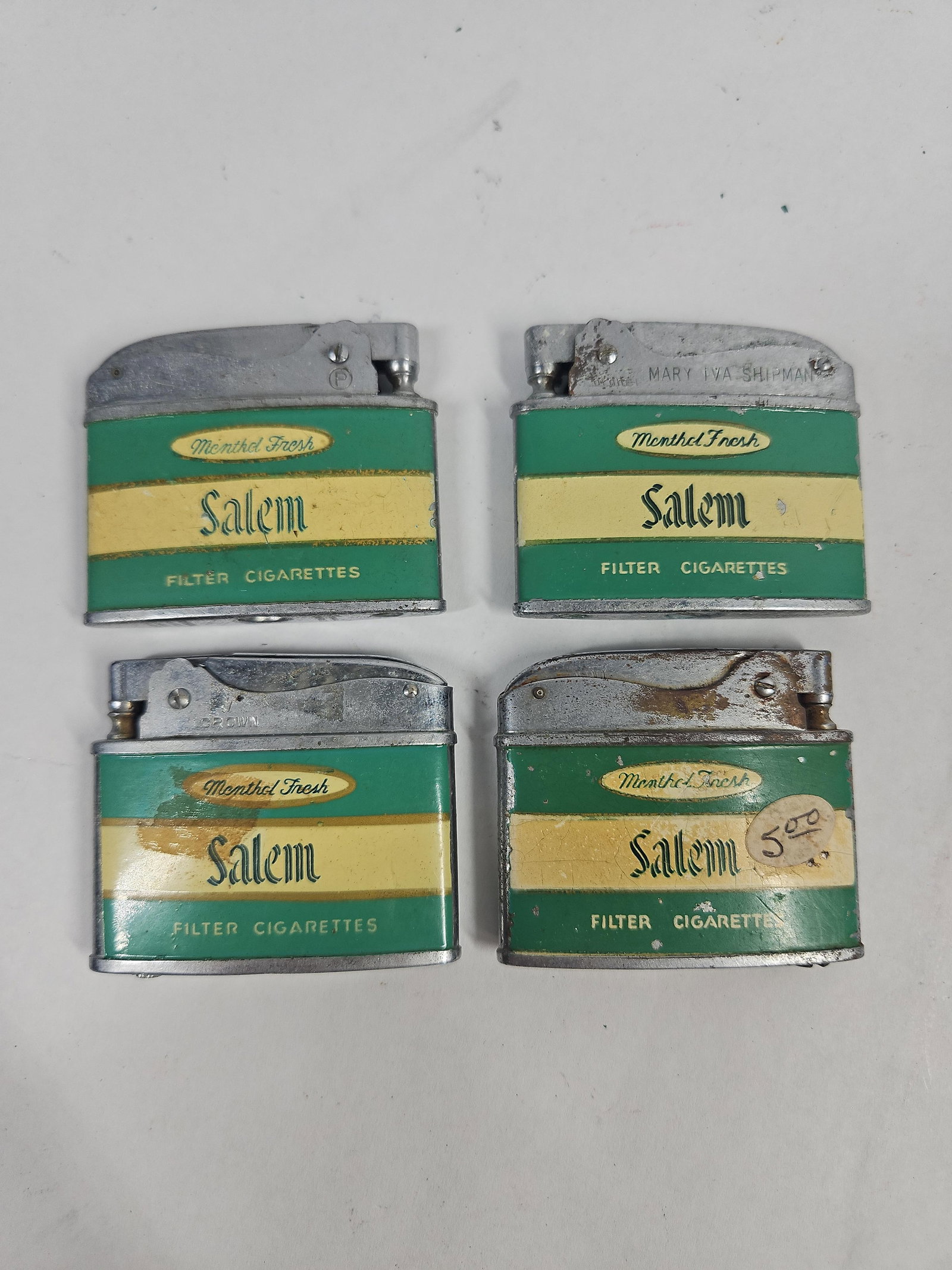 Set 4 Vtg Salem Menthol Pocket Lighters: This group consists of four vintage semi-automatic pocket lighters featuring promotional branding for Salem Menthol Fresh Filter Cigarettes. These items date to the mid-20th century and feature