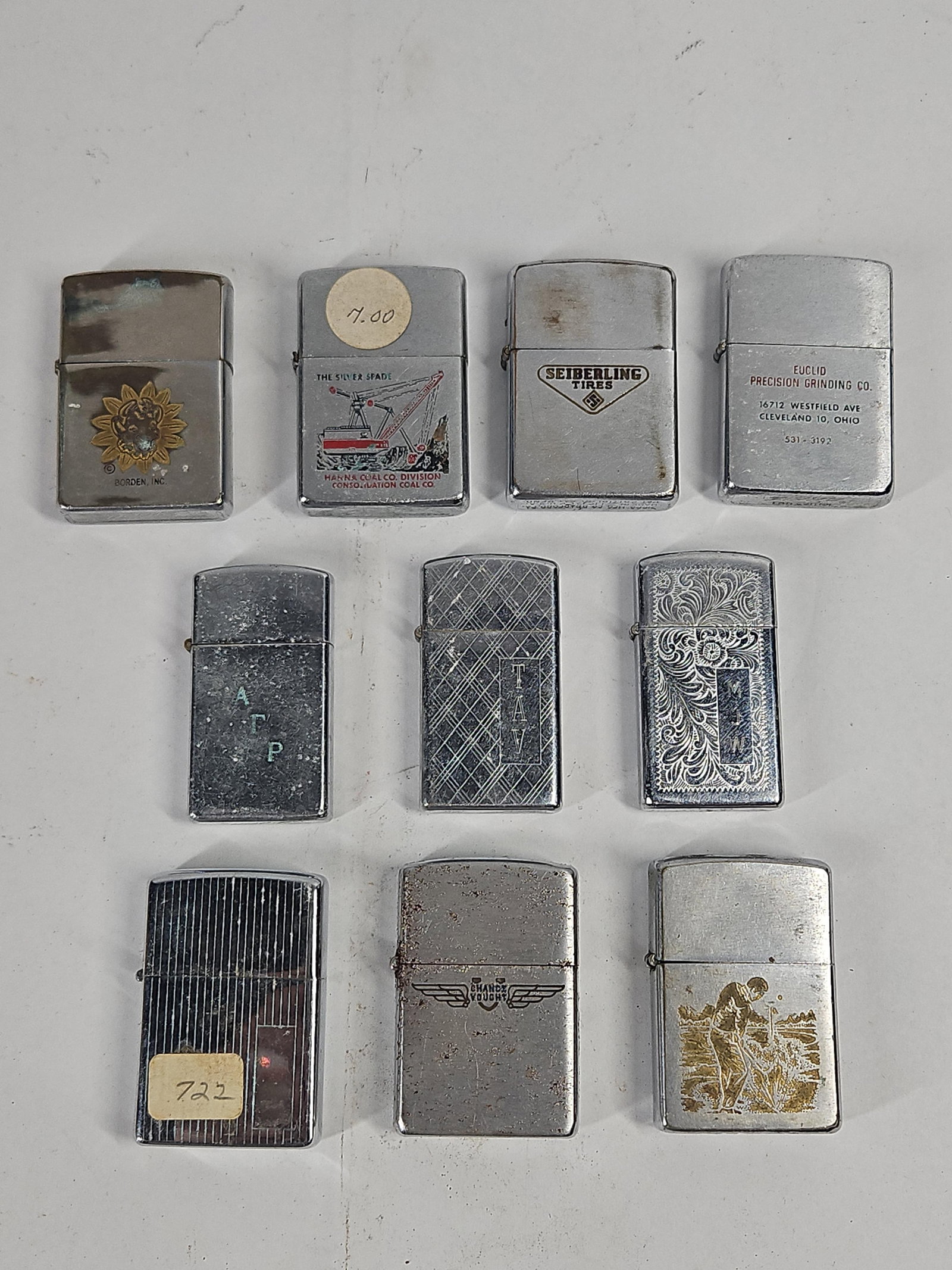 Vtg Zippo Advertising & Design Lighters: This collection consists of several chrome-plated Zippo pocket lighters in standard and slim sizes, all manufactured in Bradford, Pennsylvania. The assortment features a range of advertising, commemor