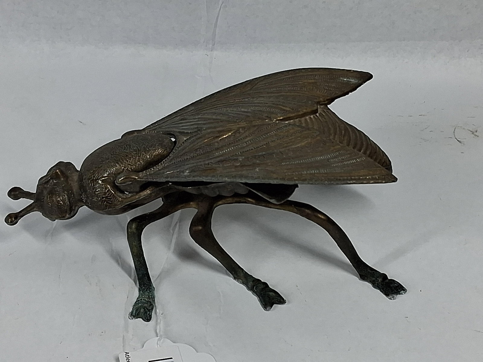Italian Brass Housefly Lidded Ashtray: An Italian cast brass novelty decorative item in the form of a large housefly, designed to function as a lidded container or ashtray. The piece features two large wings hinged at the thorax that lift