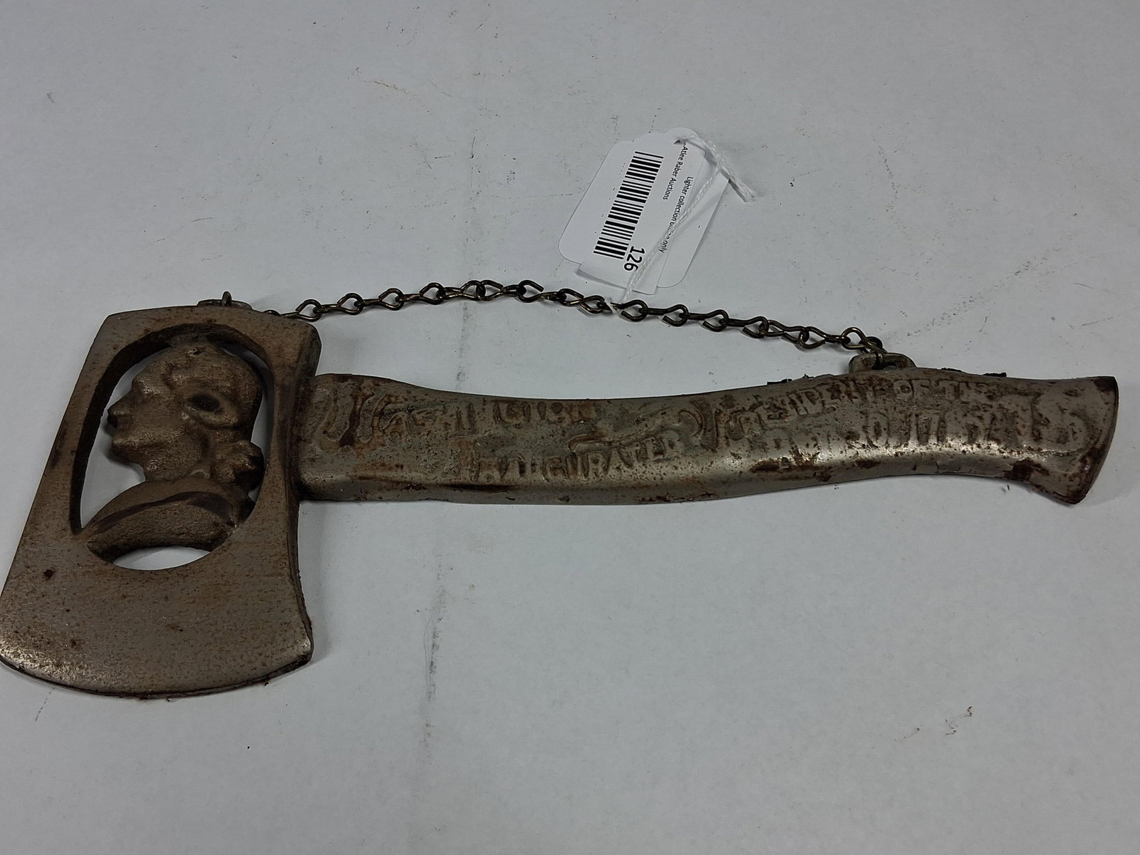 Washington Inaugural Cast Metal Hatchet: A commemorative cast metal hatchet produced as a souvenir for the centennial of George Washington's inauguration. The piece features a pierced openwork head framing a profile portrait of Washington