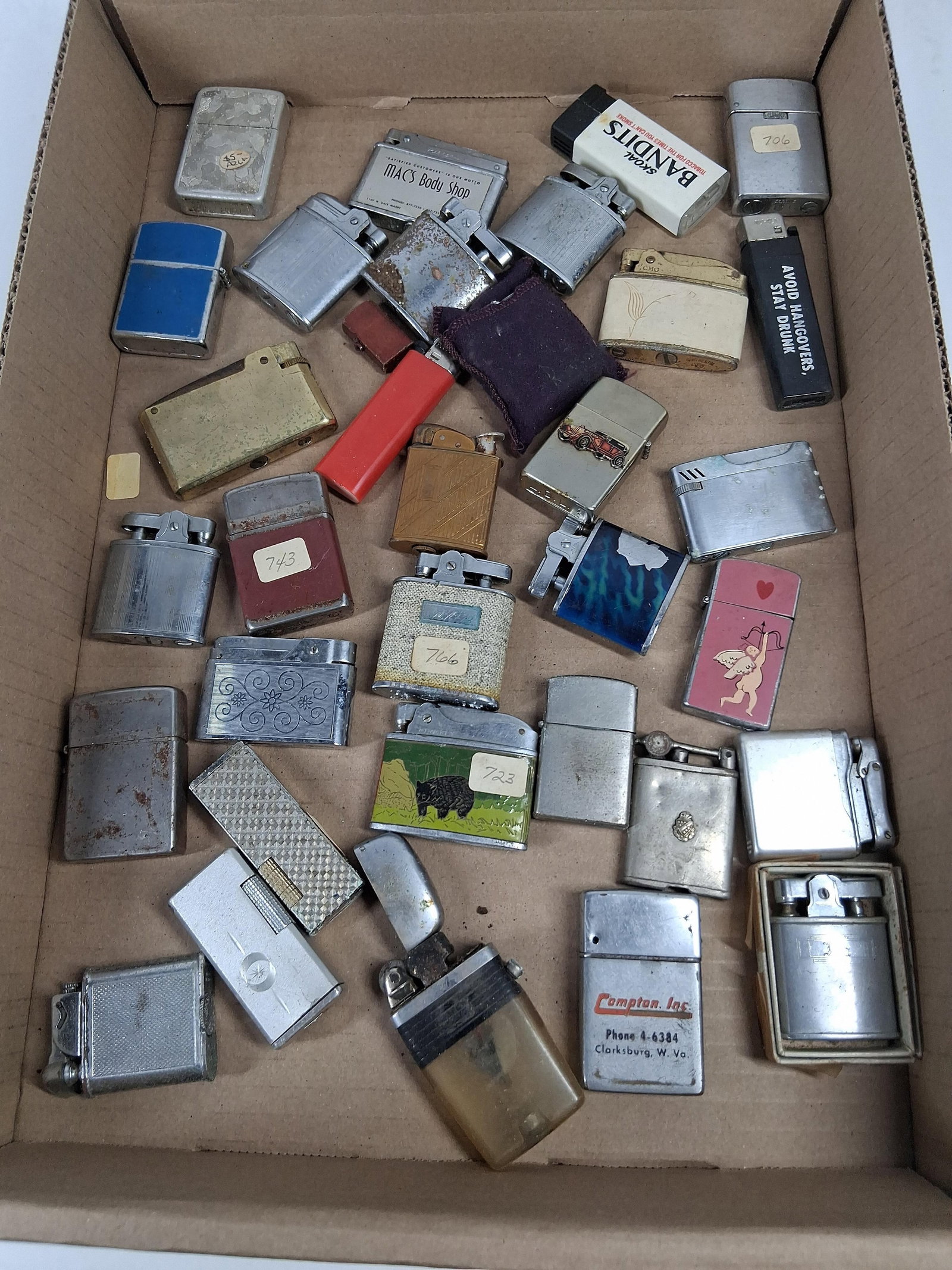 Vtg Ronson, Penguin & Bentley Lighters: An assortment of vintage and contemporary pocket lighters in various styles, including automatic, flip-top, and slide mechanisms. The collection features cases constructed from chrome-plated metal, br