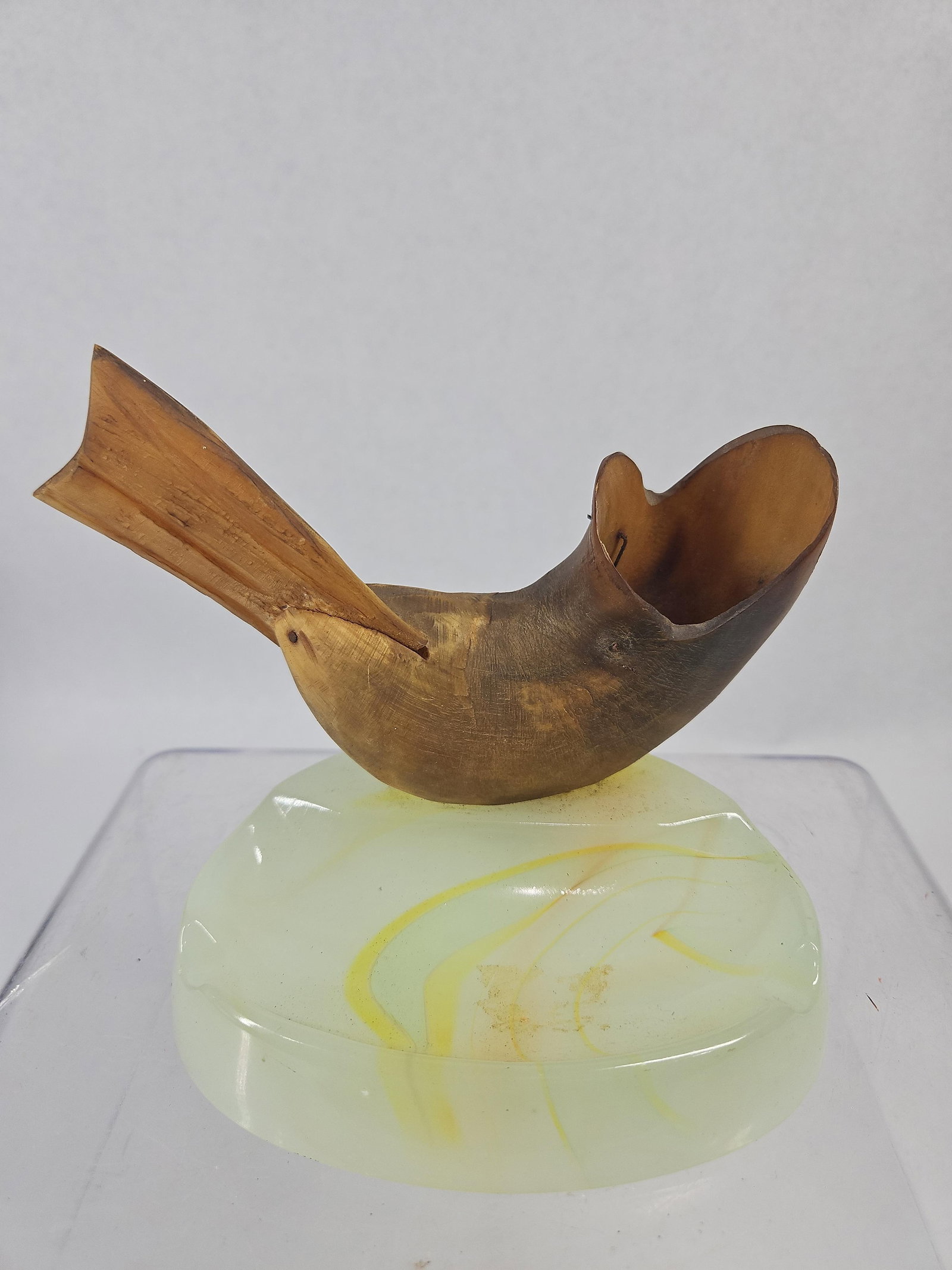 Bovine Horn Bird Figurine, Slag Glass: This stylized folk art sculpture depicts a bird in a modern form, mounted on a decorative art glass base. The bird's body is hand-carved from natural bovine horn, characterized by visible