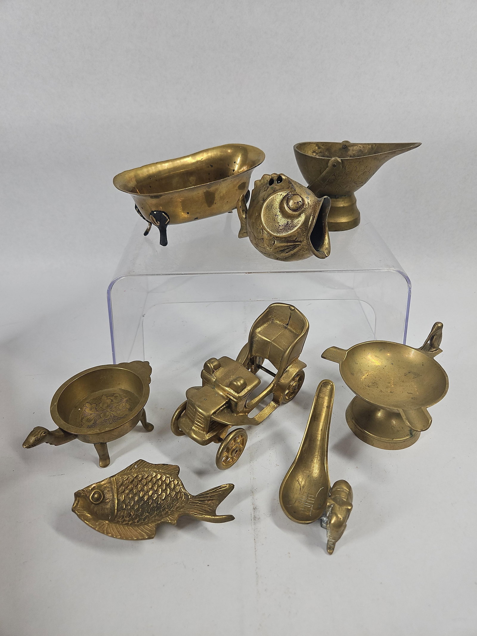 8 Miniature Brass Objects: This collection of eight solid cast brass miniature objects includes various novelty forms and small dishes. A Chinese turtle-form dish features an open circular bowl with three legs and a protruding