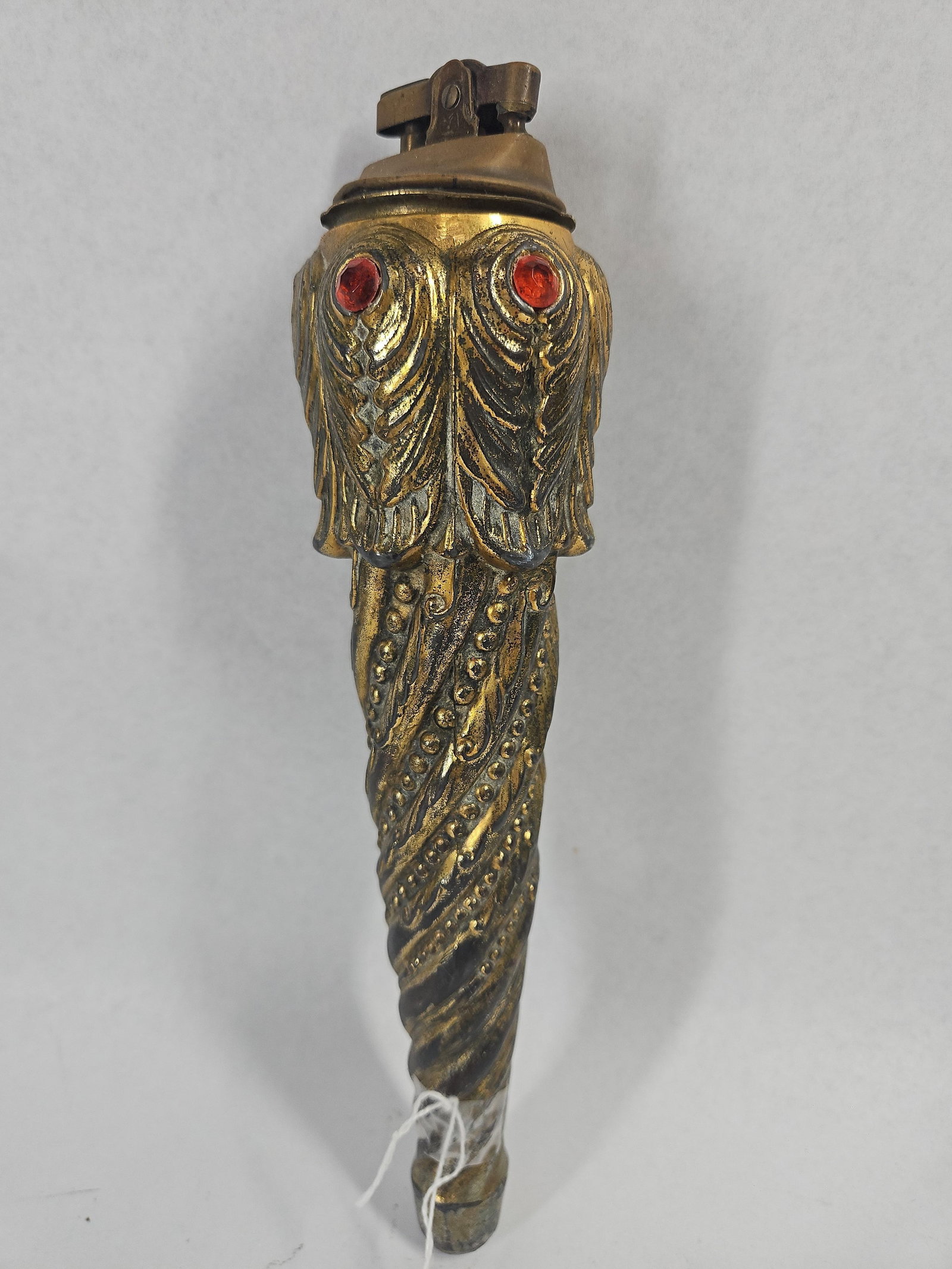 Vtg Cast Metal Owl Torch Table Lighter: A vintage table lighter designed in the form of a long, tapered torch or scepter. The body is constructed from cast metal with an antiqued gold-toned finish. The upper portion is molded into the
