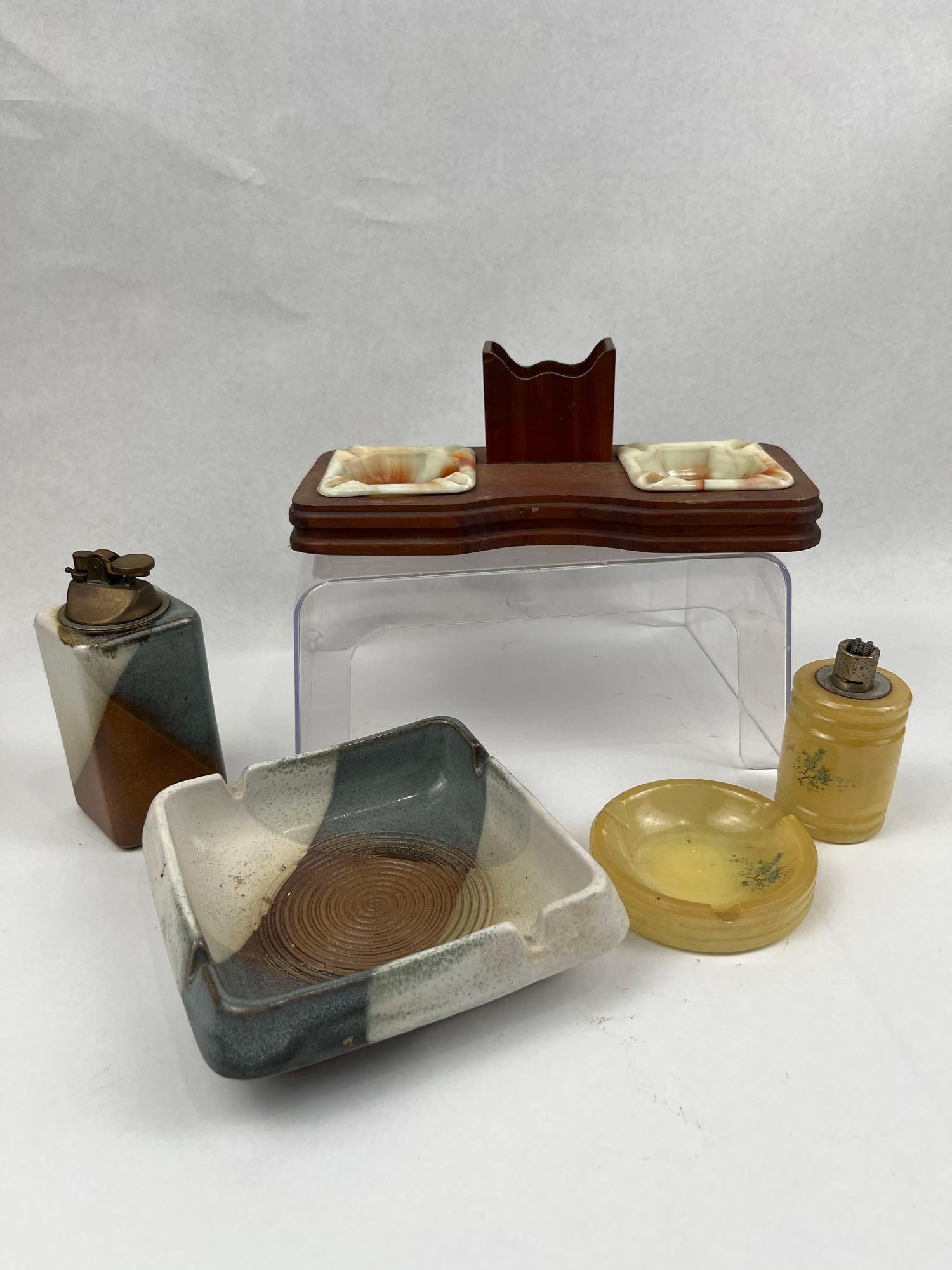 M(1)i(2)d(3)-(4)C(5).(6) (7)P(8)o(9)t(1: This group of mid-century smoking articles features three distinct sets accompanied by a clear acrylic display riser. The first set is a wooden desktop stand with a curved front profile and a central
