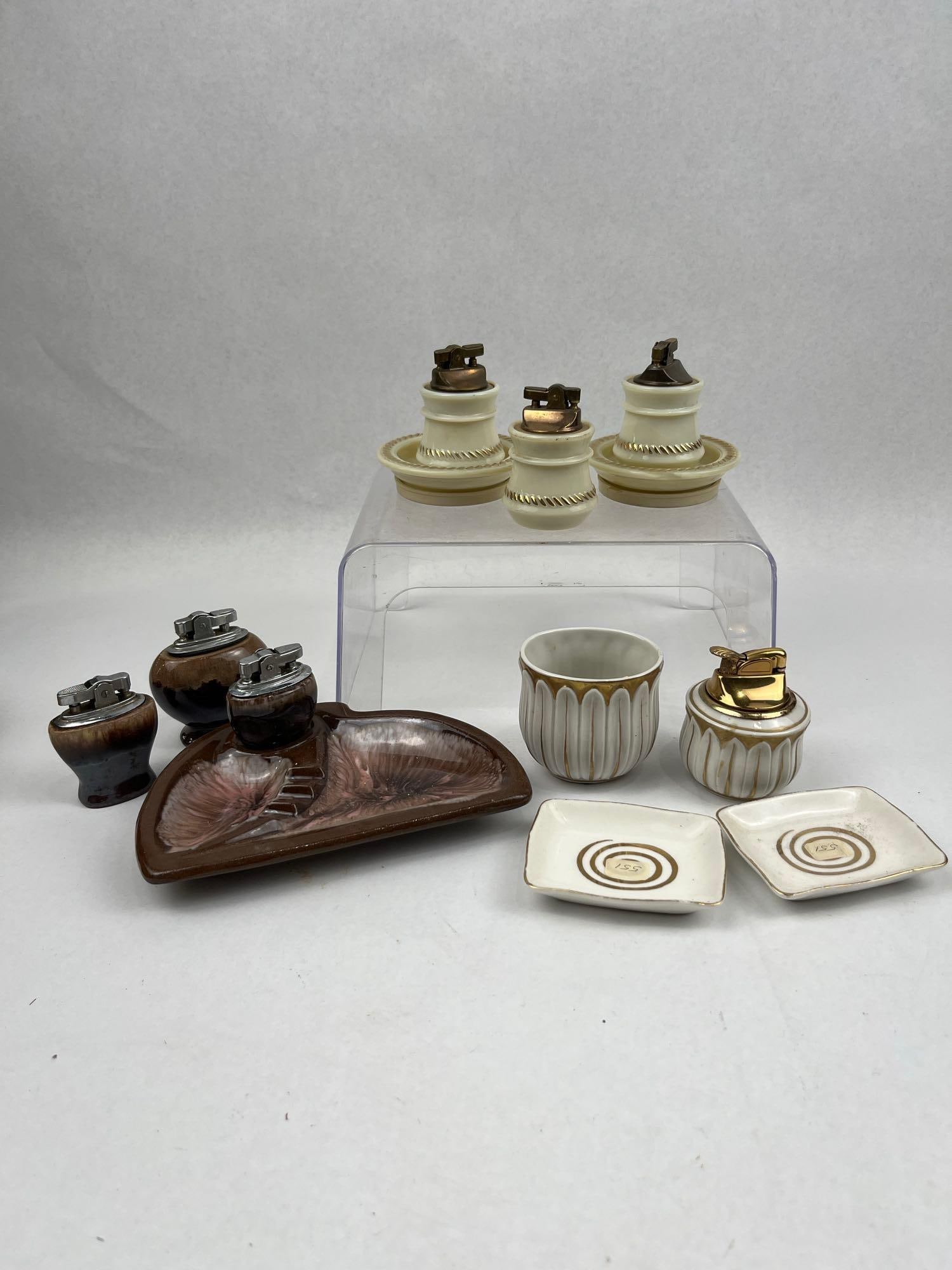Hull & Goddess Vtg Smoking Accessories: A collection of vintage smoking accessories comprising multiple sets and individual pieces. The collection includes a brown earthenware ashtray and three matching table lighters featuring a brown and
