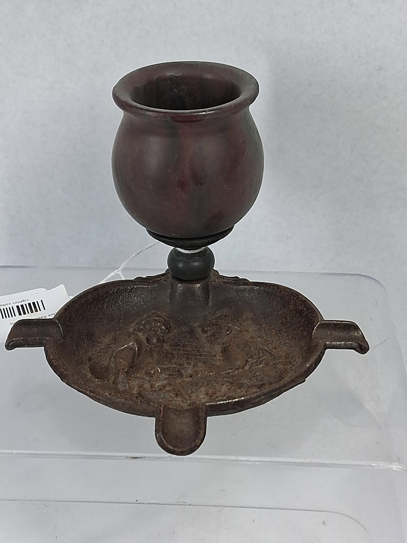 Cast Iron & Stone Figural Smoker Stand: This antique smoker's accessory, commonly referred to as a smoker's companion or stand, features a mixed-media construction comprising a cast iron base and a turned stone upper vessel. The oval base