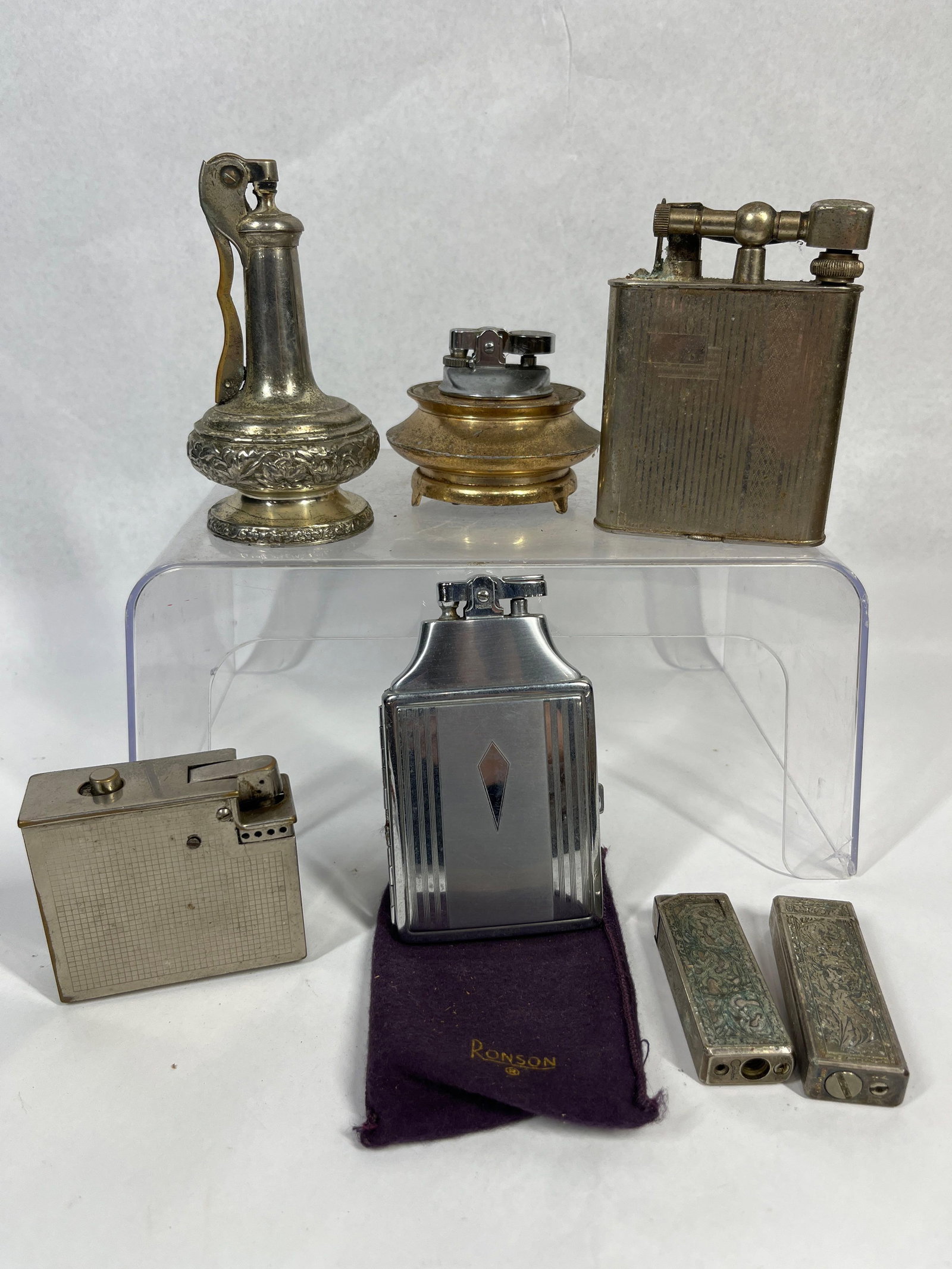 Vtg Ronson & Colibri Lighter Collection: A collection of vintage cigarette lighters featuring a mix of table and pocket models in various metallic finishes. The group includes an Art Deco combination cigarette case and lighter featuring a