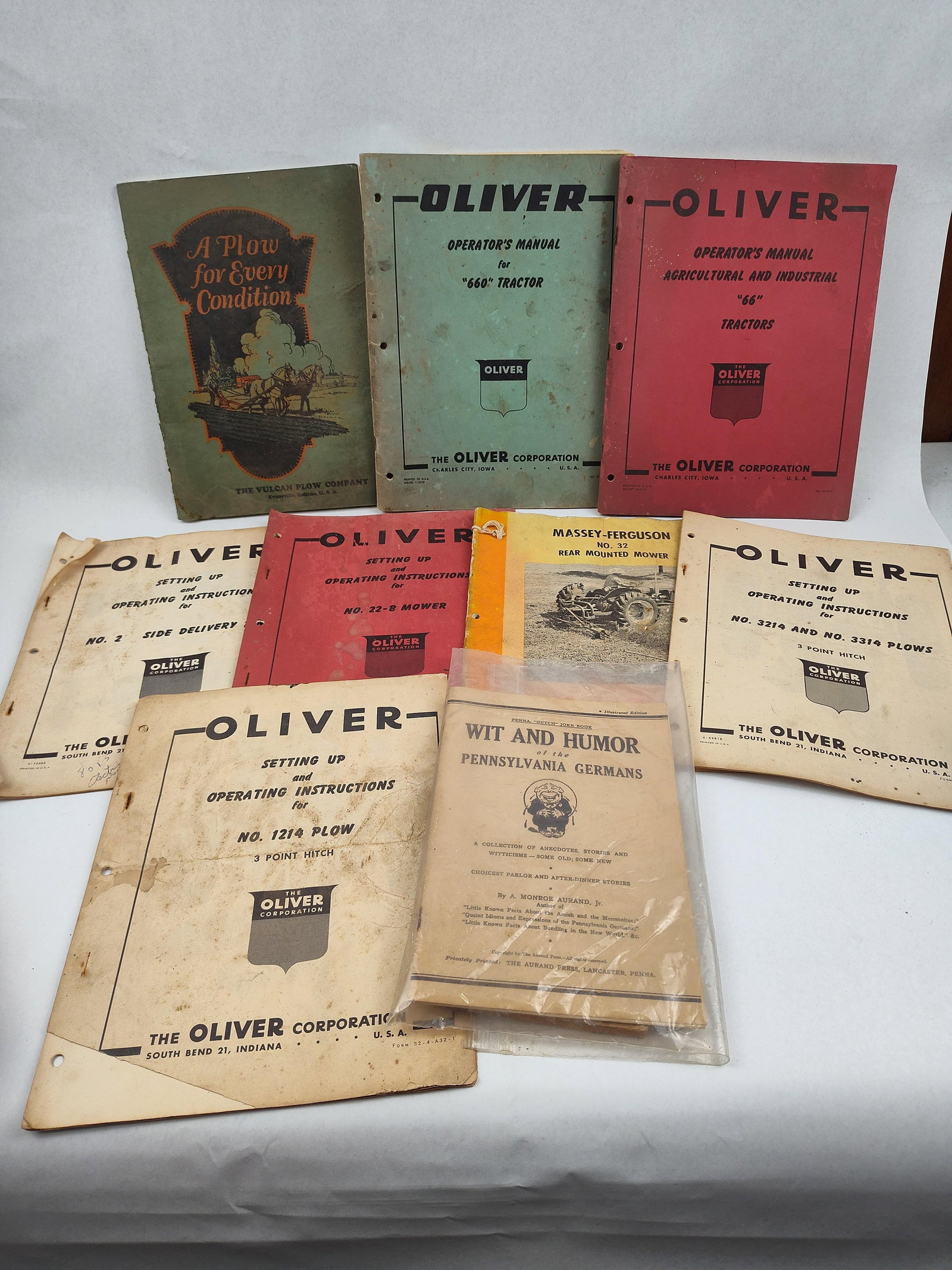 Agricultural Manuals & Ephemera 1920-59: A collection of vintage softcover agricultural equipment manuals, promotional booklets, and regional ephemera, primarily focusing on items from The Oliver Corporation. The assortment includes multiple