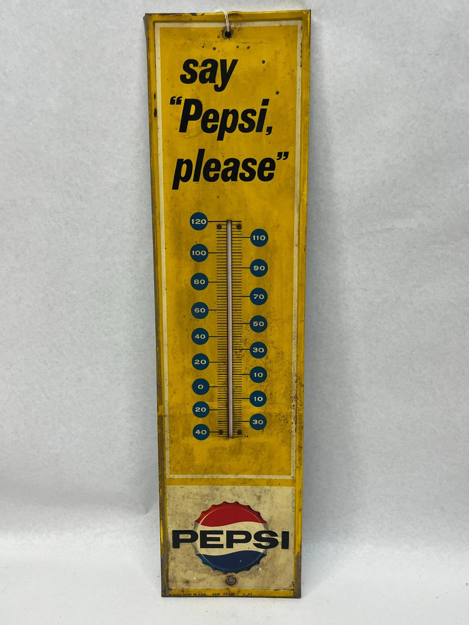 1963 Pepsi-Cola Thermometer Sign: An American-made vertical advertising thermometer sign for Pepsi-Cola. The top section contains printed black lettering reading 'say "Pepsi, please"'. A functional glass thermometer tube is secured