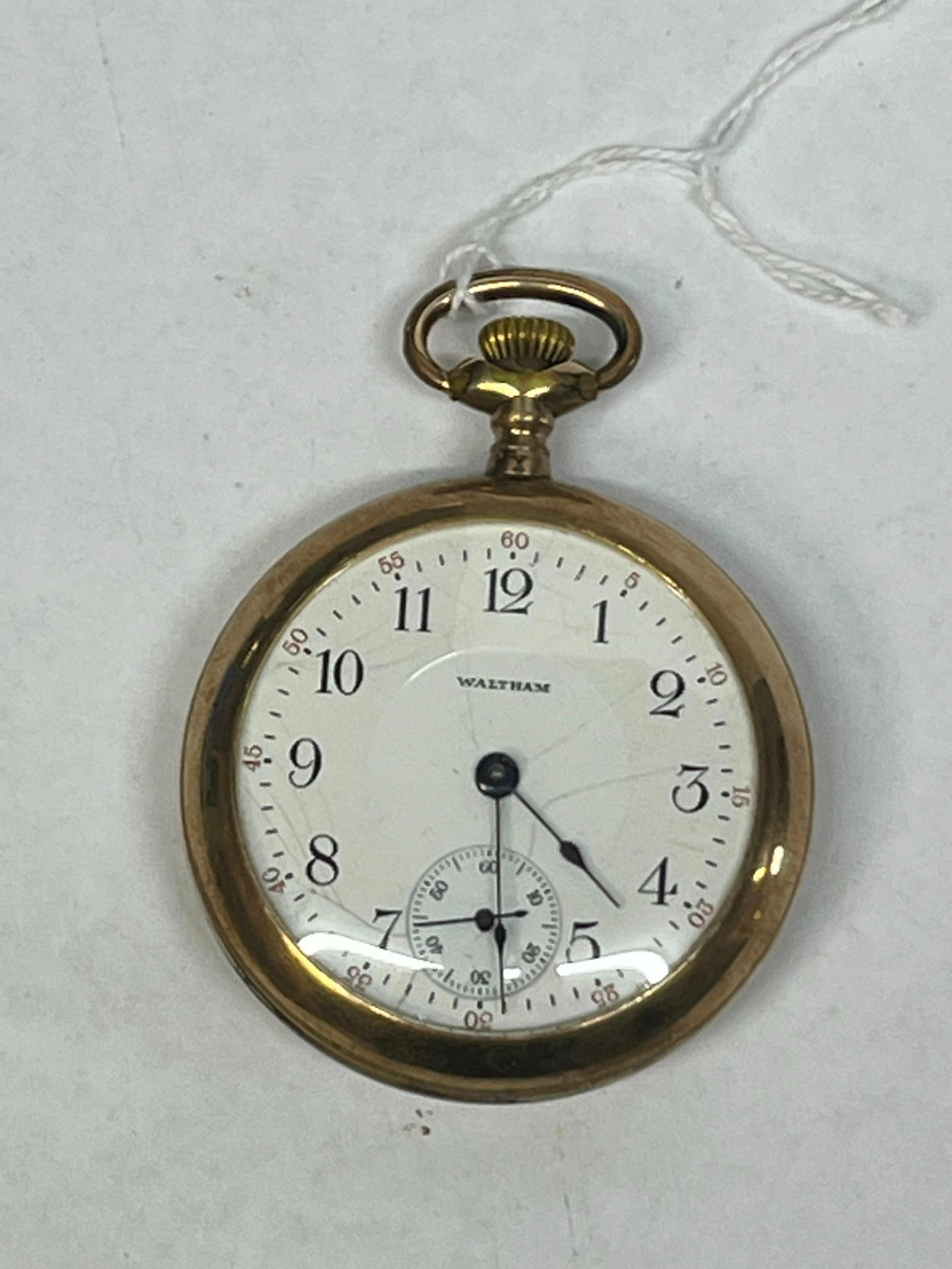 American Waltham 17 Jewel Pocket Watch: This is an American Waltham Watch Company open-face pocket watch featuring a manual wind, 17-jewel movement. The hands are blued steel in a spade style. The gold-filled case interior is stamped with
