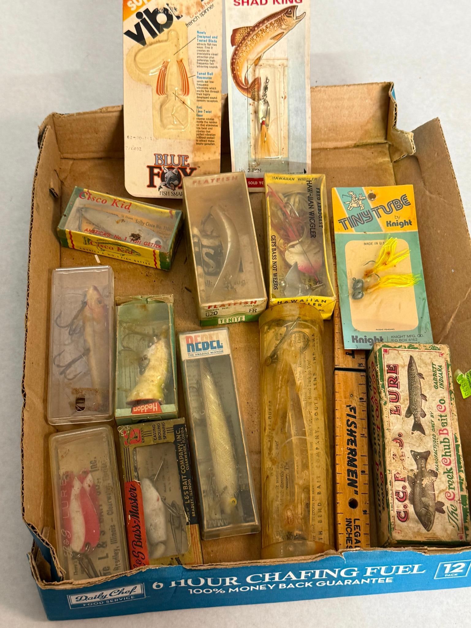 Creek Chub, Arbogast & South Bend Lures: An assortment of fishing lures and related tackle items, many contained in their original retail packaging. The collection includes a Blue Fox Super Vibrax french spinner, a Hildebrandt?s Shad King