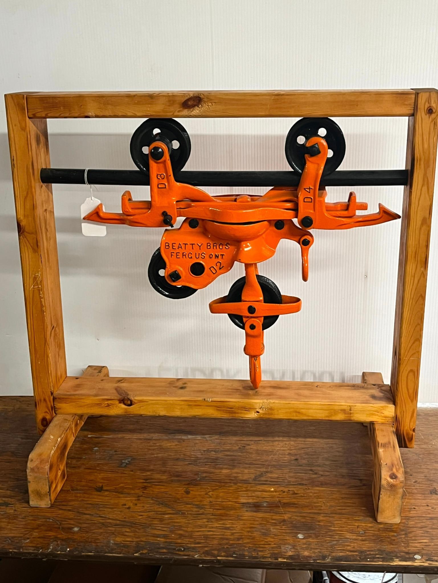 Beatty Bros. Iron Hay Trolley w/ Pulley: This antique agricultural hay trolley was manufactured by Beatty Bros. Constructed of heavy cast iron, this industrial tool was originally designed to run along a steel track in a barn loft to