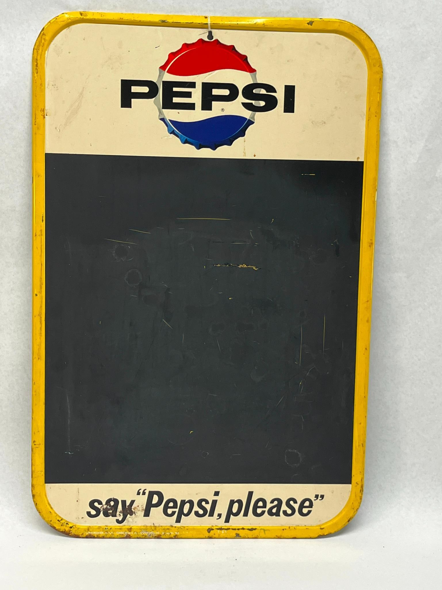 Stout Sign Co Pepsi-Cola Chalkboard '65: This is a rectangular American metal advertising sign featuring a chalkboard menu area. The piece is constructed from painted tin or steel with rounded corners and a raised yellow-painted border. The