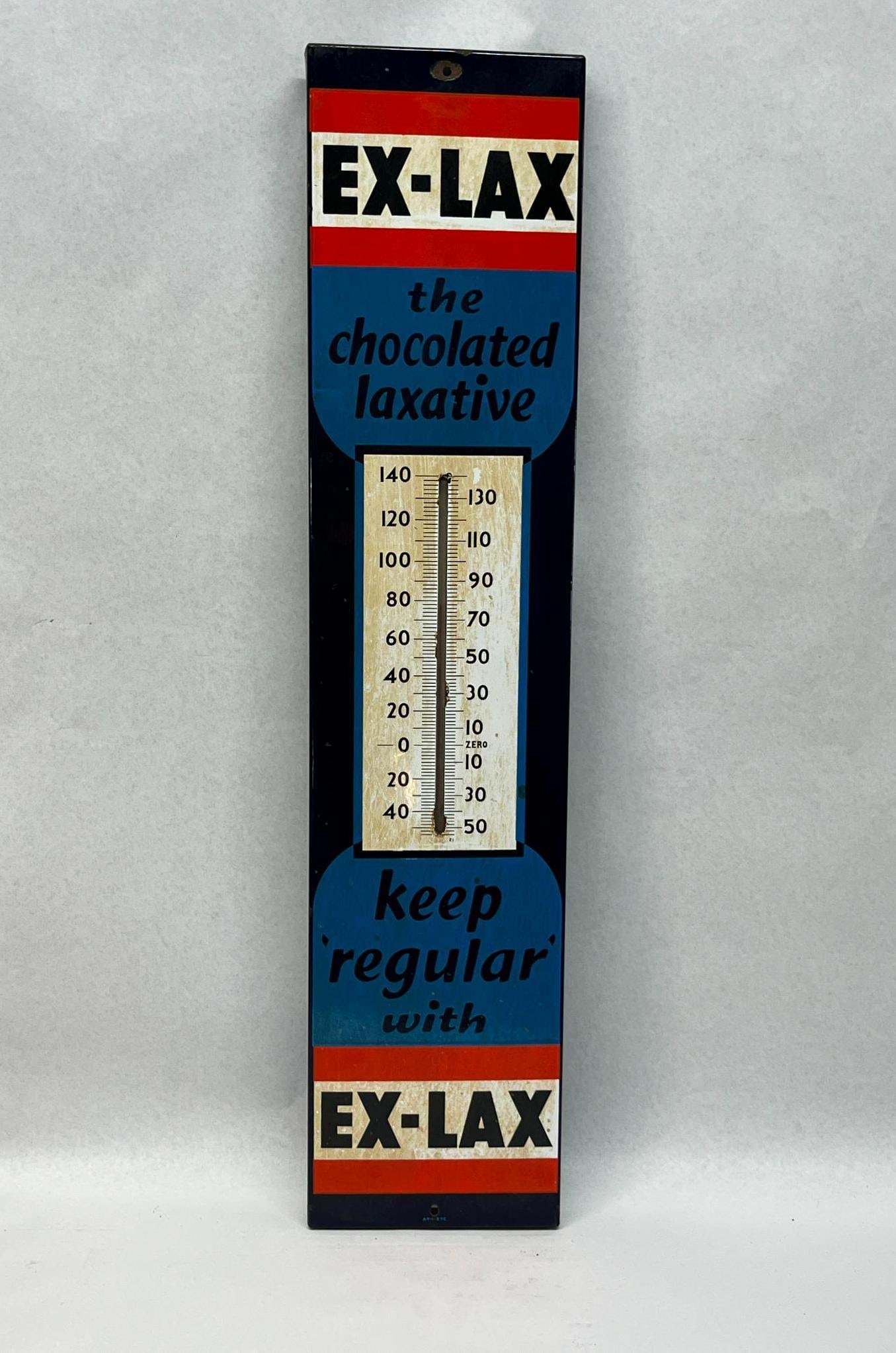 Ex-Lax Porc. Enamel Thermometer Sign: A mid-century vertical advertising thermometer for Ex-Lax. The sign is constructed from heavy-gauge enameled steel featuring a four-color palette. The central blue panels contain black cursive script 