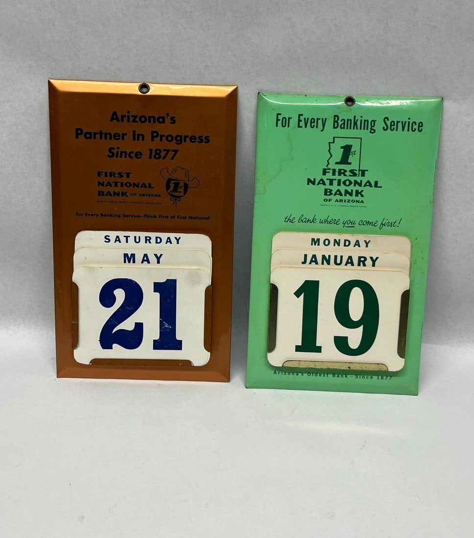 Pair John Rosen Arizona Bank Calendars: A pair of mid-century advertising perpetual calendars for the First National Bank of Arizona, manufactured by John Rosen of Phoenix. The set consists of one copper-toned metal calendar frame and one
