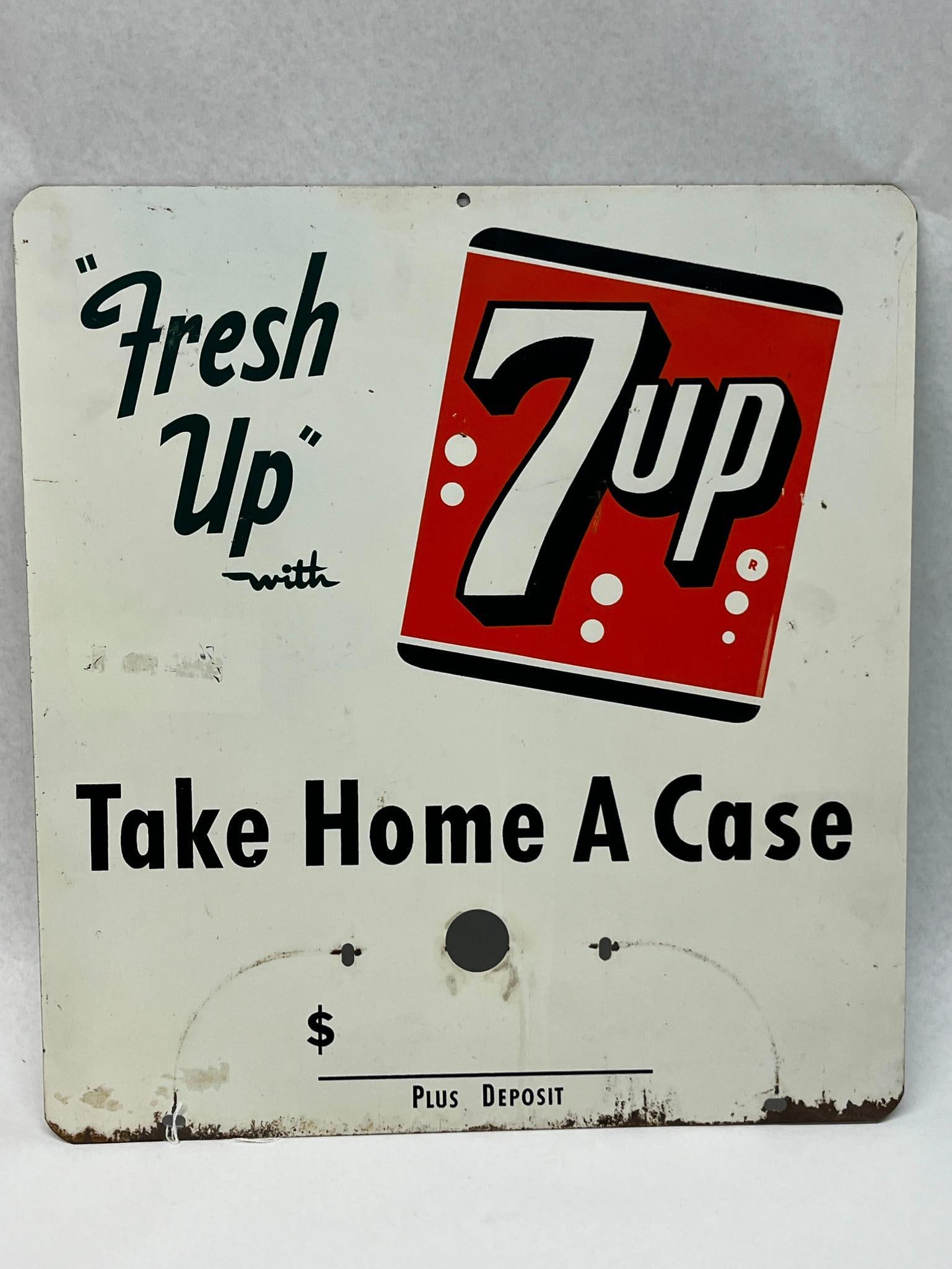 7-Up Metal Fresh Up Topper Sign: A mid-century advertising sign for 7-Up, manufactured from lithographed steel. The center right contains the 7-Up logo positioned within a tilted red square bordered in black; the 7 and up are white