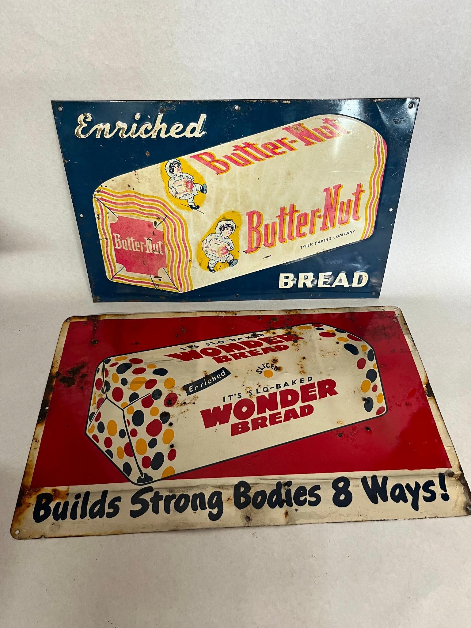 Pair Butter-Nut & Wonder Bread Signs: This lot consists of two single-sided metal advertising signs for commercial bread brands from the mid-20th century. The main text reads Butter-Nut with the subtext TYLER BAKING COMPANY printed below