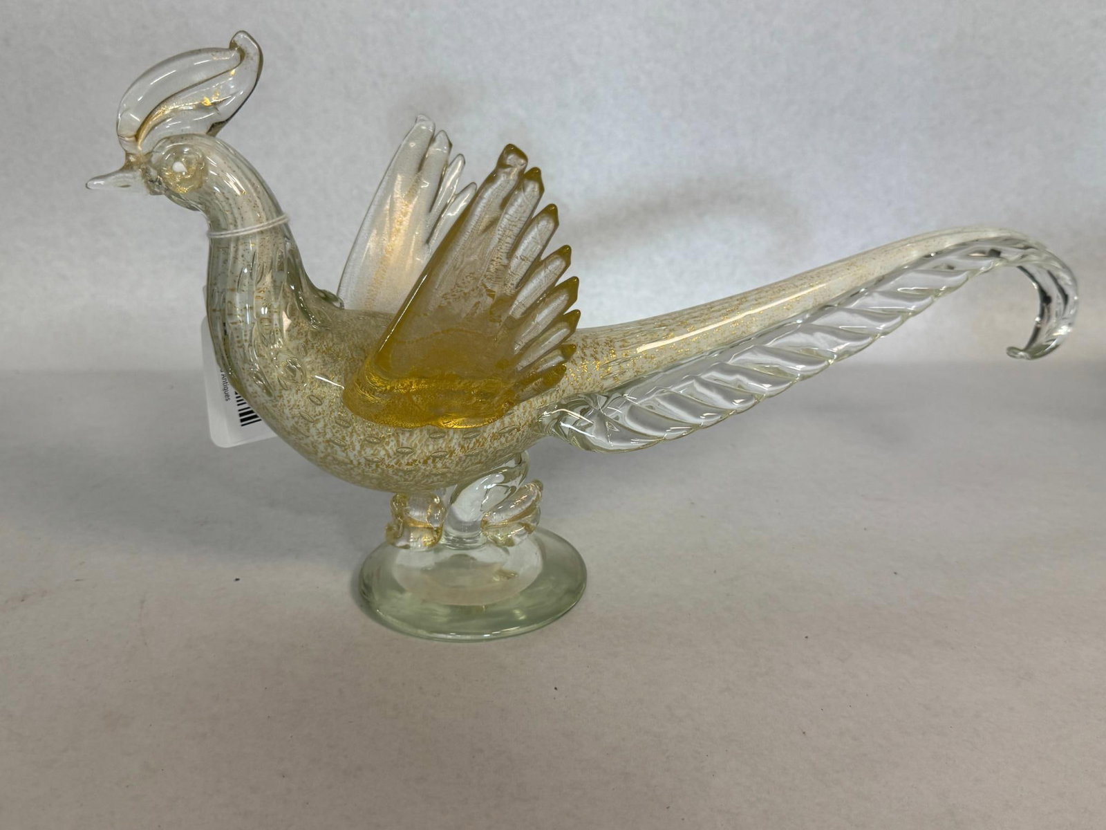 Murano Aventurine & Bullicante Pheasant: A stylized hand-blown art glass pheasant figurine, characterized by mid-century modern Venetian design. Features clear glass throughout the body and sweeping tail, integrated with controlled bubble de