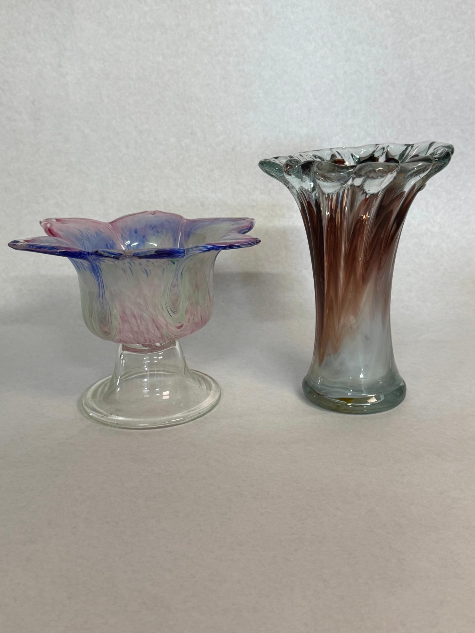 Pair Hand-Blown Ruffled Art Glass: Two hand-blown art glass pieces consisting of a footed bowl and a fluted vase. The body is decorated with internal multicolored swirls of pink, blue, and pale green, supported by a clear glass
