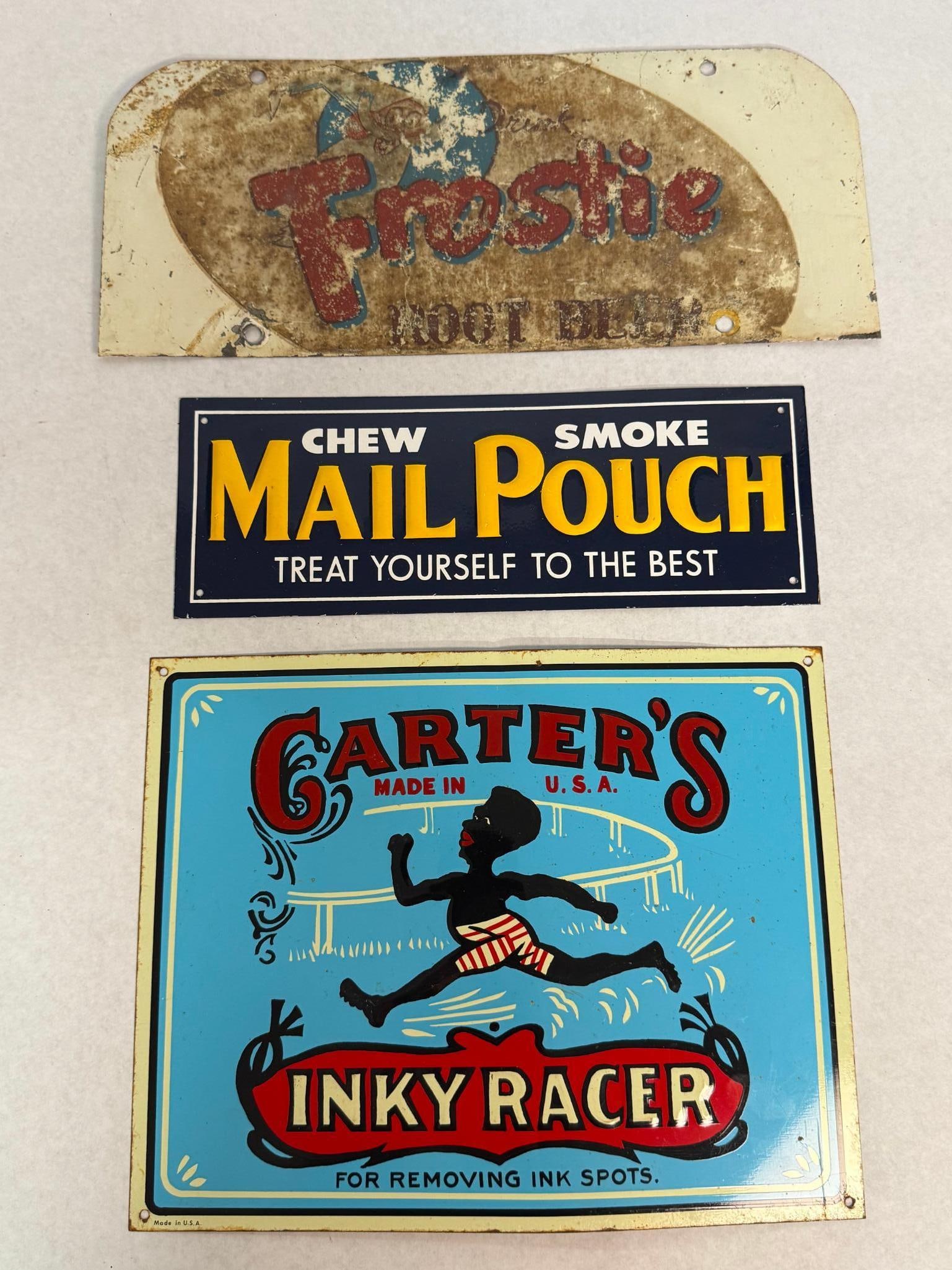 Carter's, Mail Pouch & Frostie Signs: This lot features three embossed metal advertising signs representing various mid-20th-century American brands. Below the brand, it reads MADE IN U.S.A. A red banner at the bottom contains the