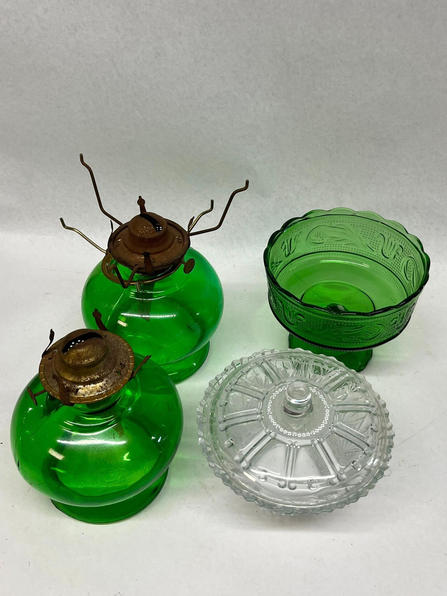 E.O. Brody Emerald Glassware & Bowl: An assortment of mid-century American glass items featuring emerald green and clear colorways. Included is an emerald green pressed glass footed bowl produced in Cleveland, Ohio. The underside of the