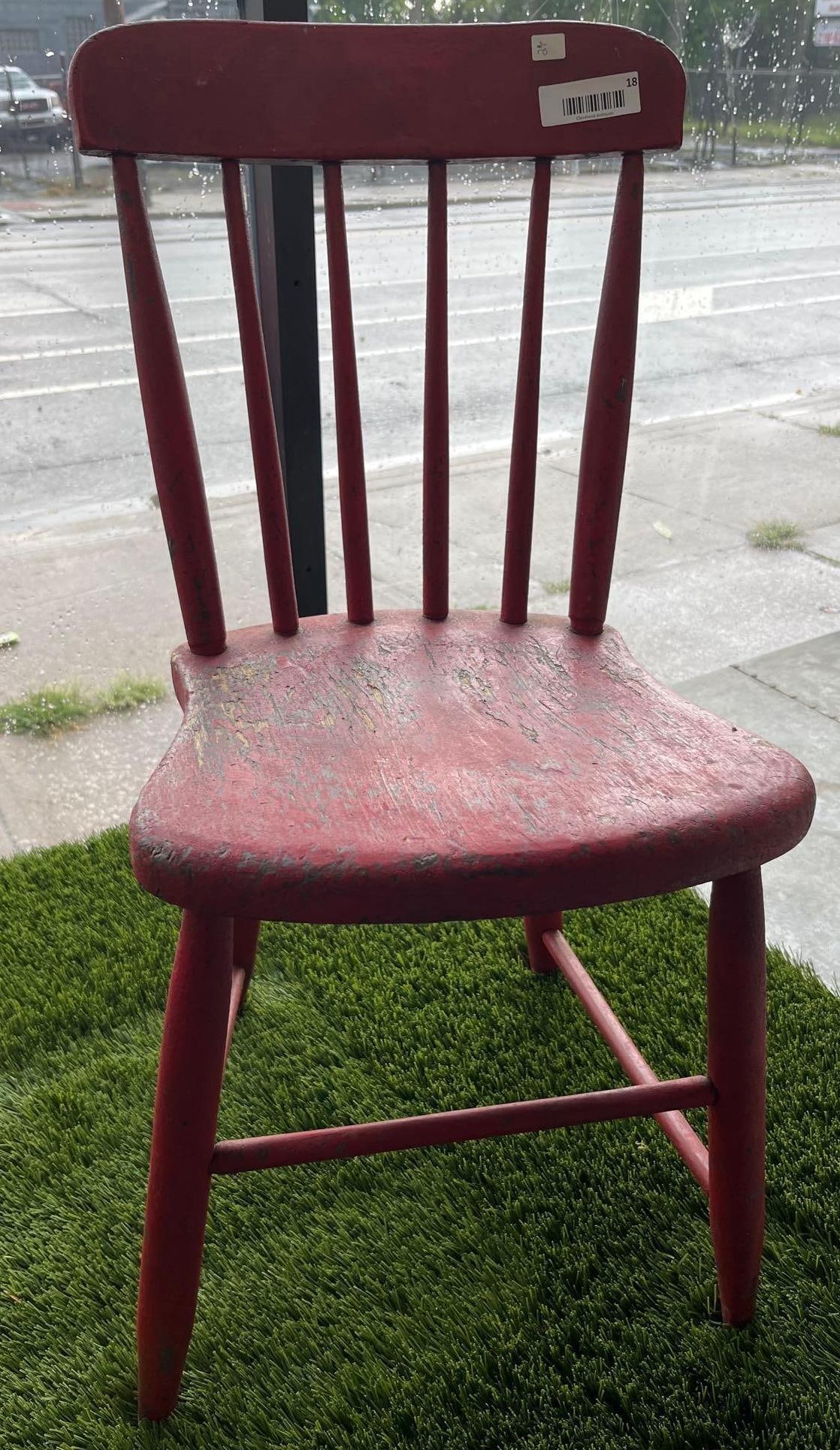 Red-Painted American Spindle Side Chair: A American country-style side chair featuring a spindle-back design. The chair is constructed with a wide, rounded rectangular crest rail supported by seven tapered spindles. The shaped solid wood sea