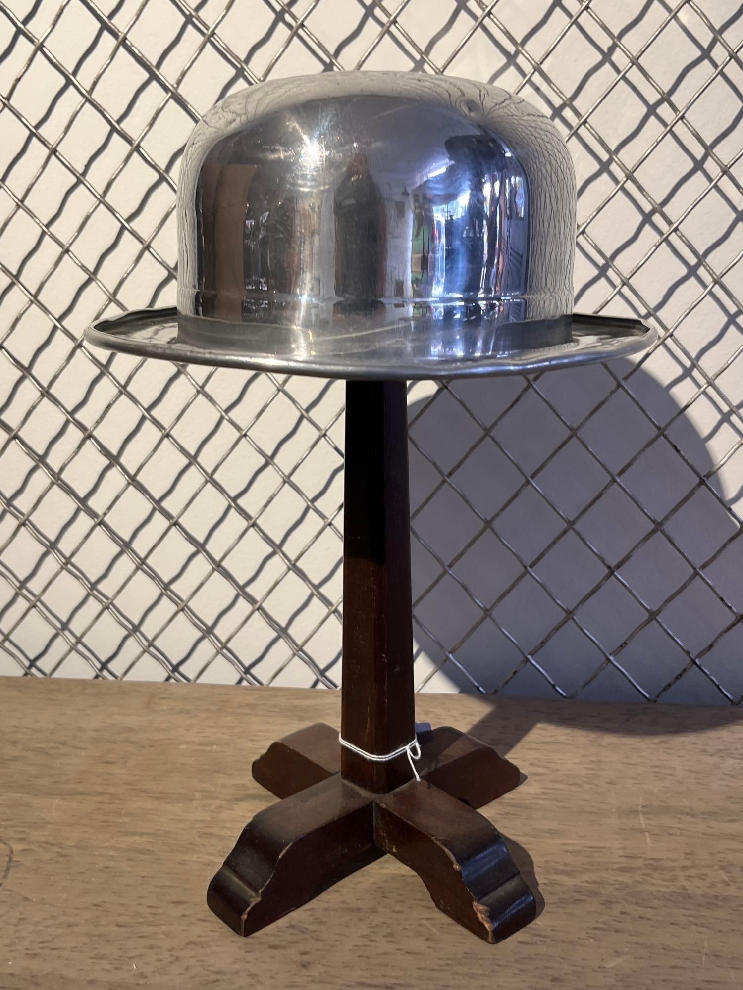 Luma-Lite Bowler Hat Ice Bucket w/Stand: This mid-century novelty ice bucket or lidded dish is designed in the form of a bowler or derby hat. The hat is manufactured from spun and polished aluminum, featuring a domed crown and a wide, slight