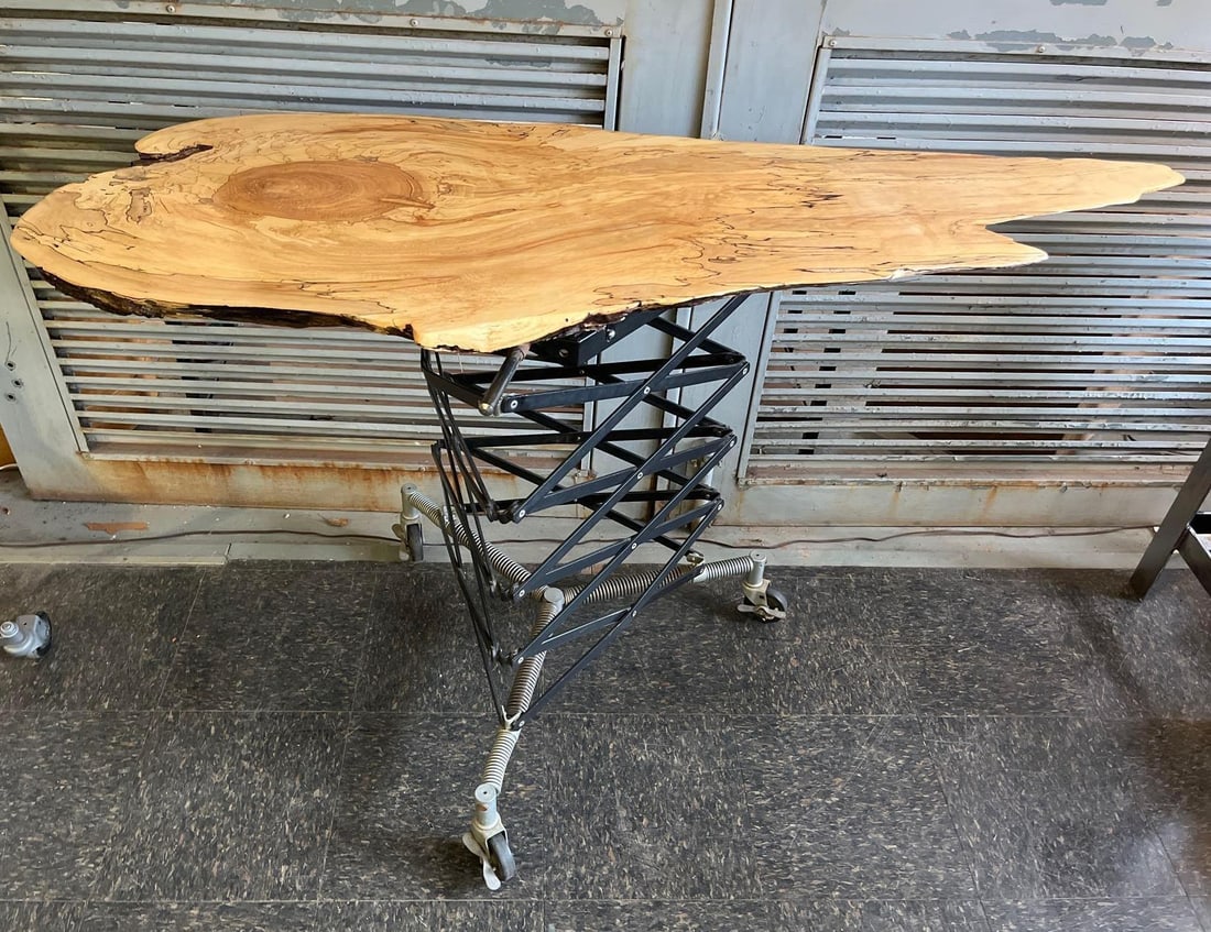 Spalted Maple Live Edge Studio Table: This custom-made studio or work table features a contemporary industrial design utilizing a repurposed mechanical base. The table top consists of a single, thick solid wood slab of spalted maple,