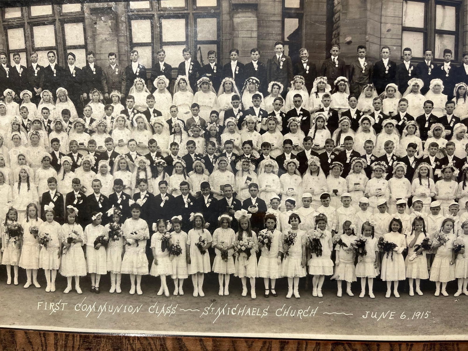 Miller Studio Pan. Communion Photo 1915: This silver gelatin panoramic photograph depicts the First Communion class of St. Michael's Church in Cleveland, Ohio. The large-scale group portrait includes over 200 participants arranged in rows