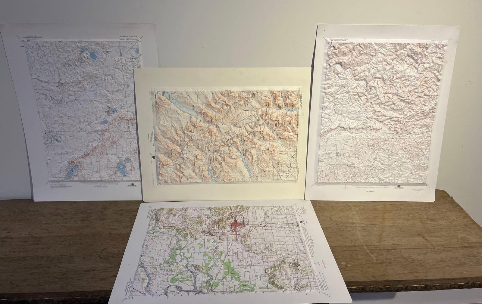 Set 4 A.J. Nystrom & Co. 3D Relief Maps: A set of four three-dimensional raised-relief topographical maps produced from vacuum-formed printed plastic. The maps were published by A. J. Nystrom and Co. of Chicago, Illinois, using